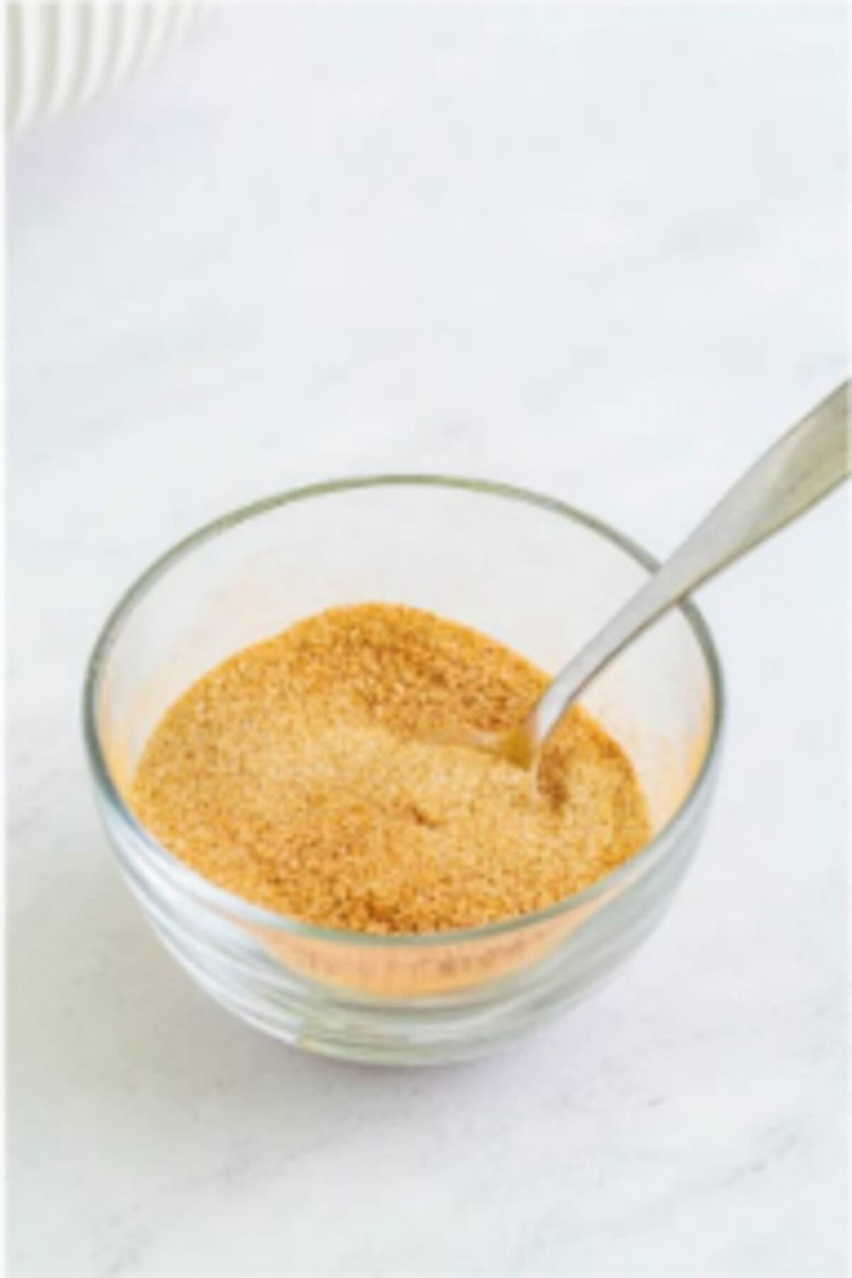 Granulated sugar and ground cinnamon mixed together in a small bowl for coating Elephant Ears.