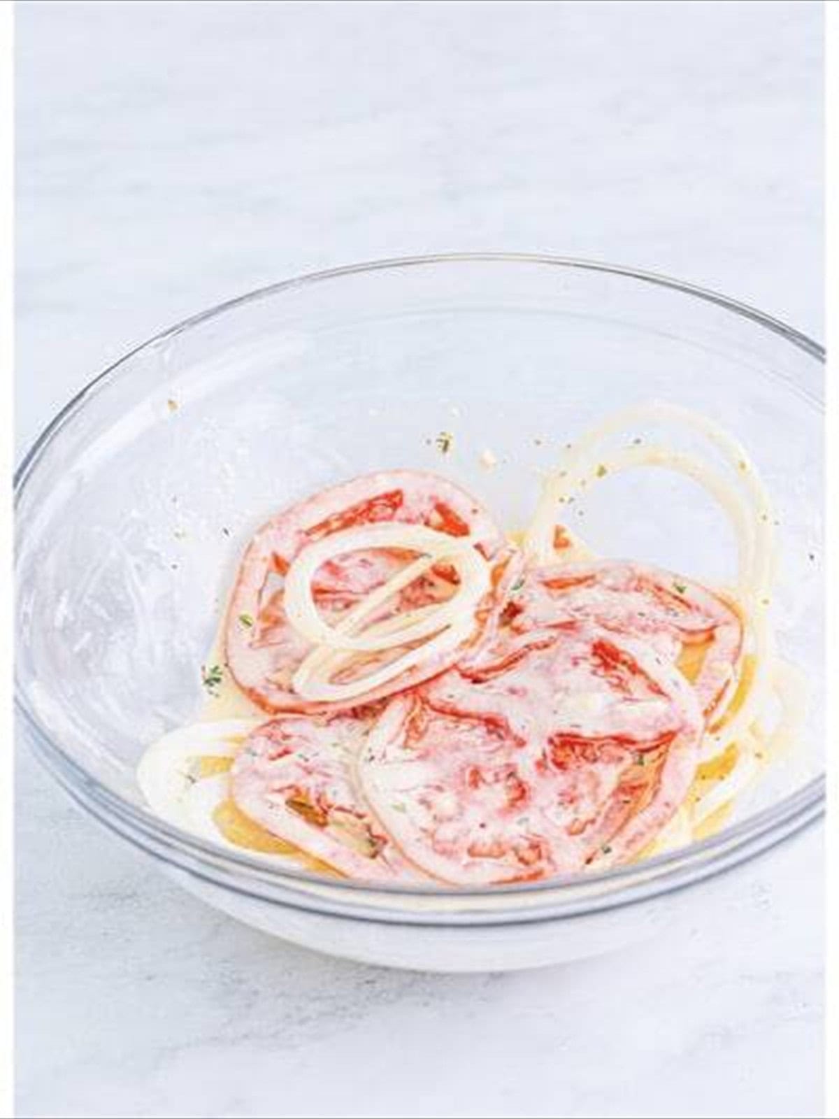 Sliced tomatoes and sweet onion tossed in the Italian dressing.