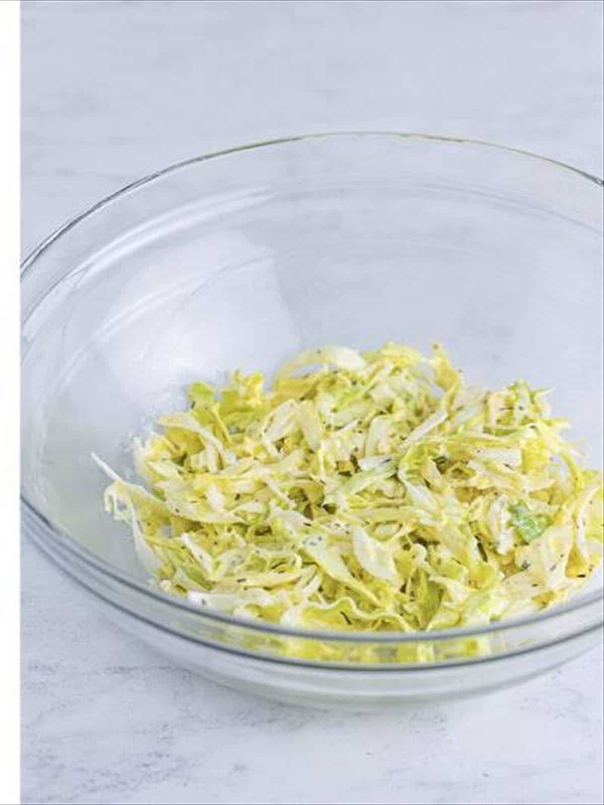 Shredded iceberg lettuce dressed with the Italian sauce.