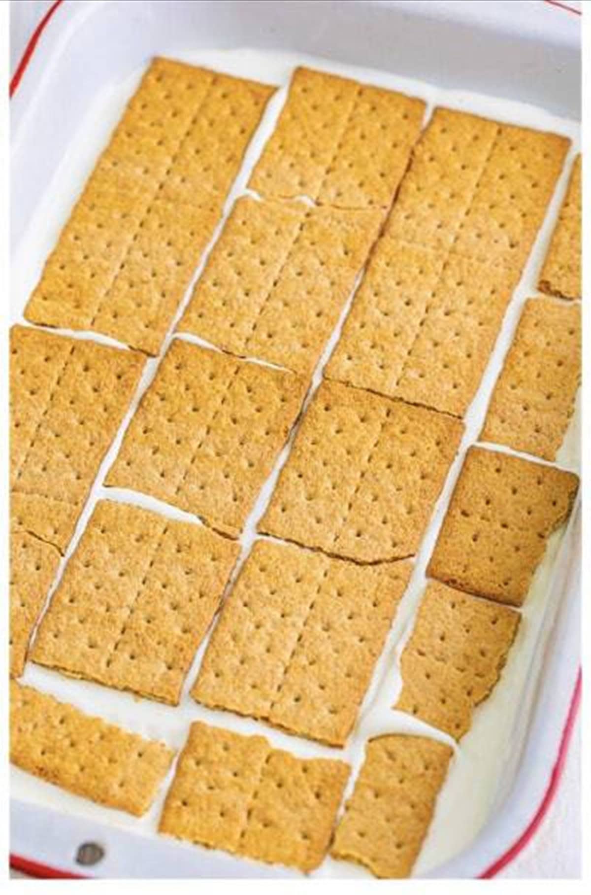First layer of graham crackers placed in a 9x13 pan for key lime eclair cake.