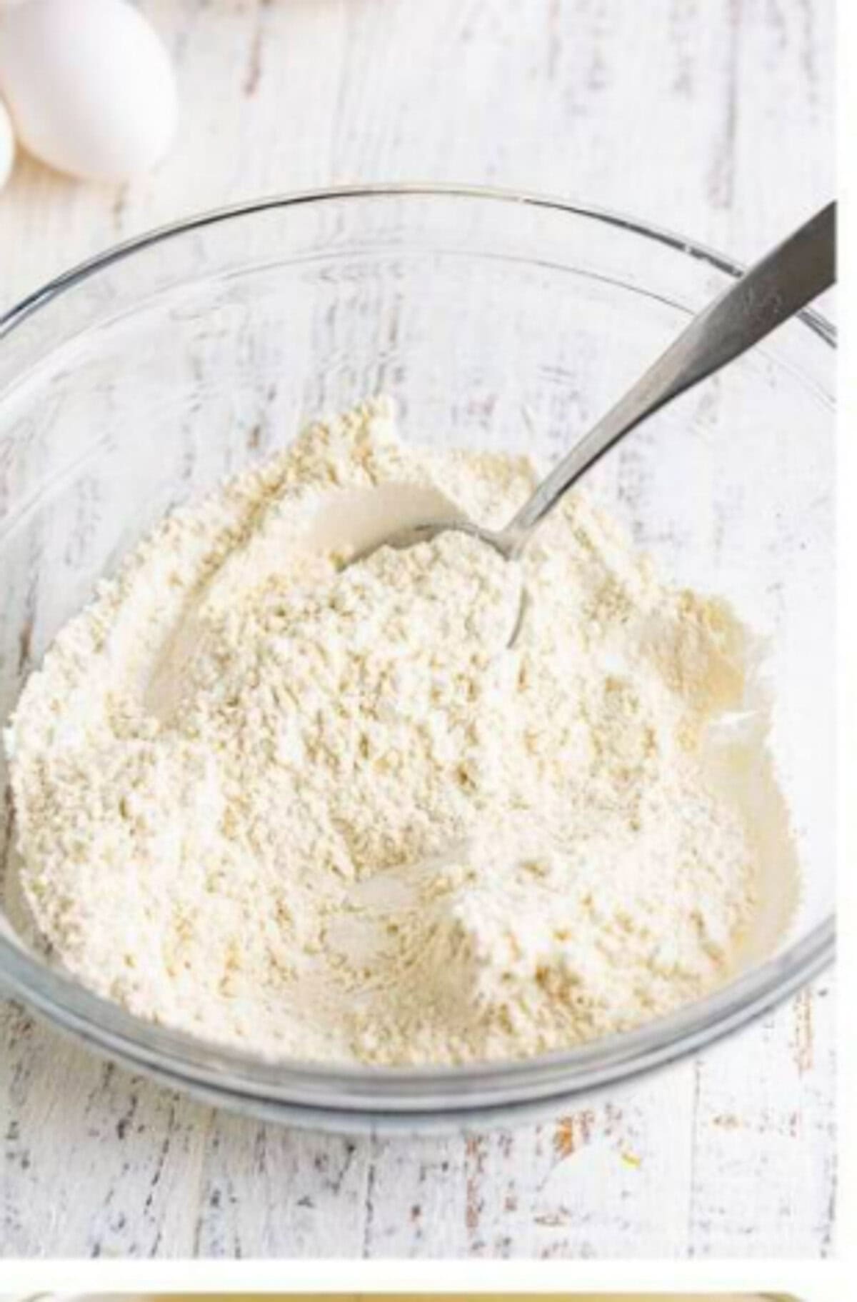 Eggs, sugar, and salt being whisked together in a heatproof bowl to start the custard base for the Homemade Lady Finger Cookies Recipe.