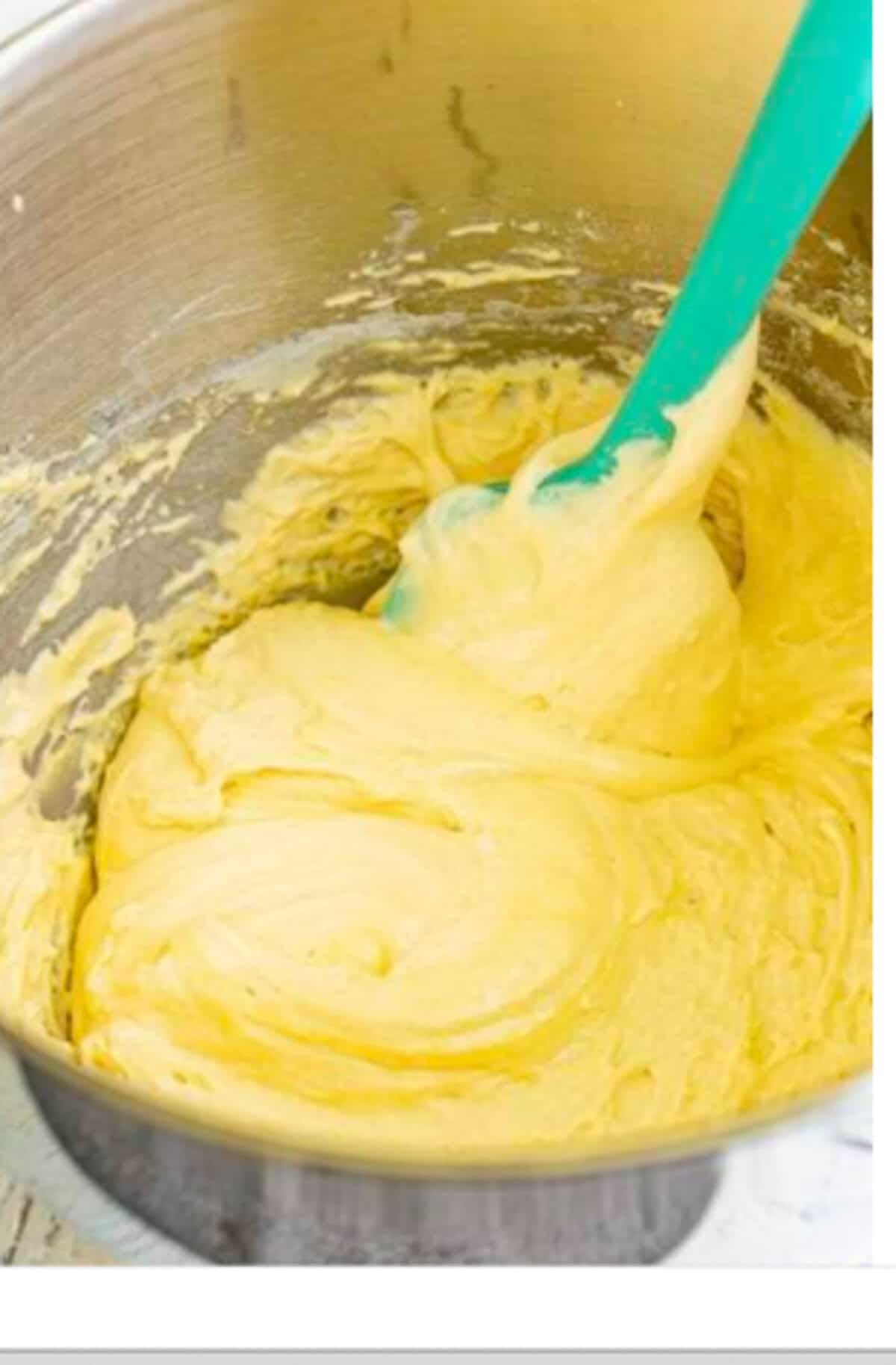 Whipped egg mixture forming light fluffy medium peaks in the stand mixer, the texture test where a dollop holds for a second then sinks back for the Homemade Lady Finger Cookies Recipe.