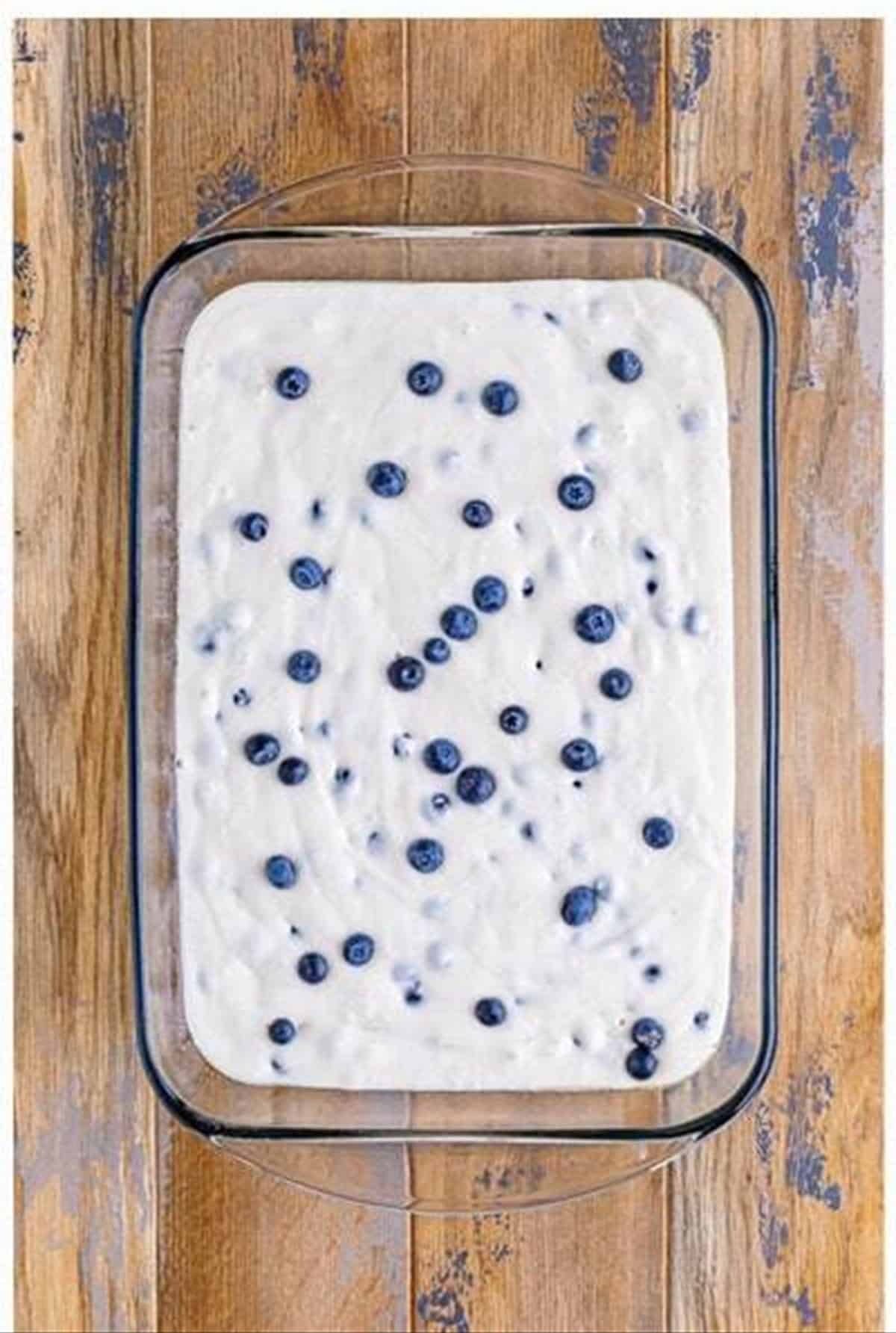 Extra blueberries sprinkled on top of the cake batter.