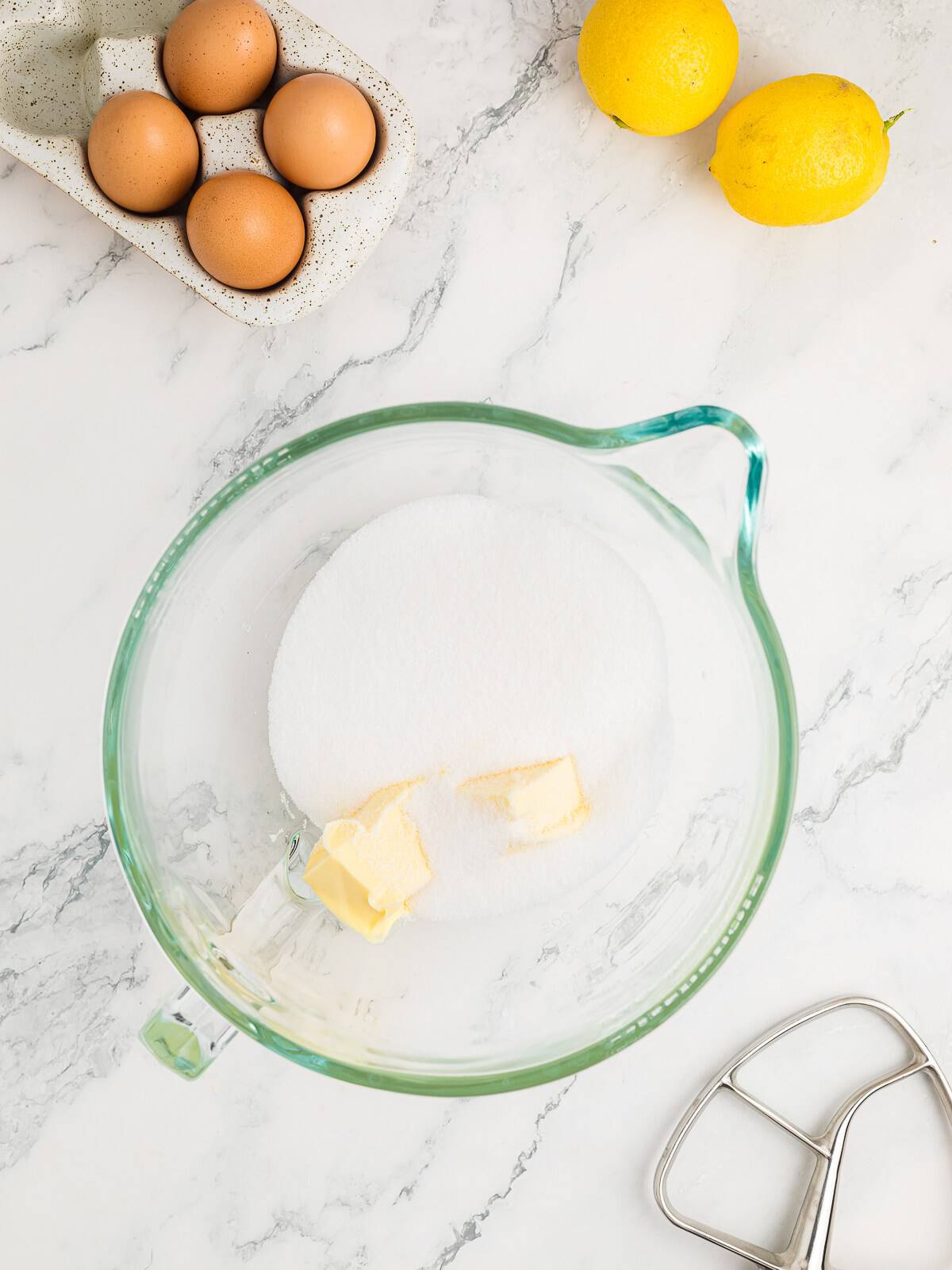 Creaming butter and sugar in a stand mixer for lemon cake.