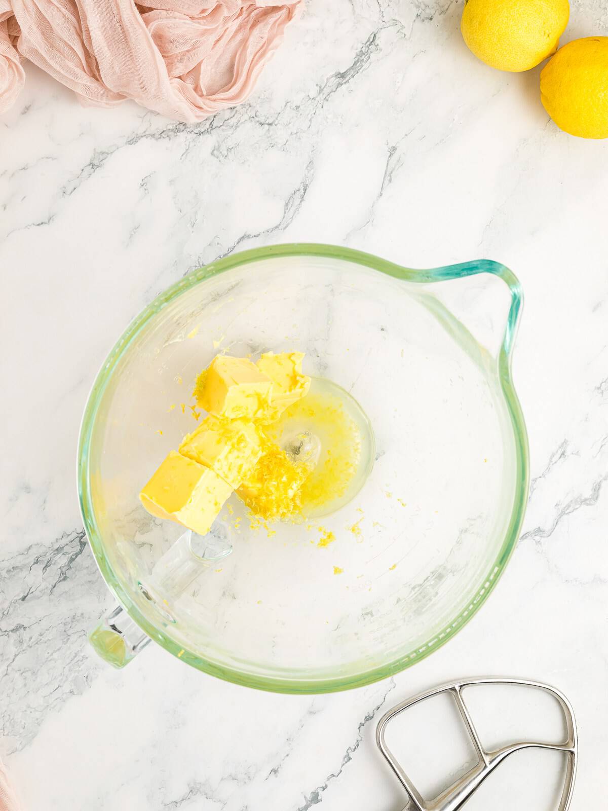 Whipping softened butter for lemon buttercream frosting.