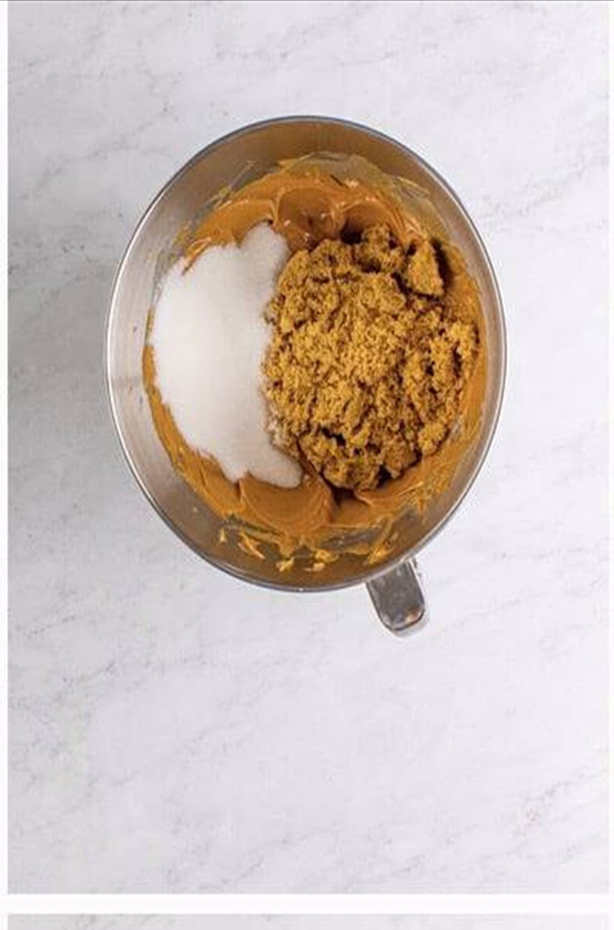 Brown sugar and granulated sugar added to creamed peanut butter and butter mix.