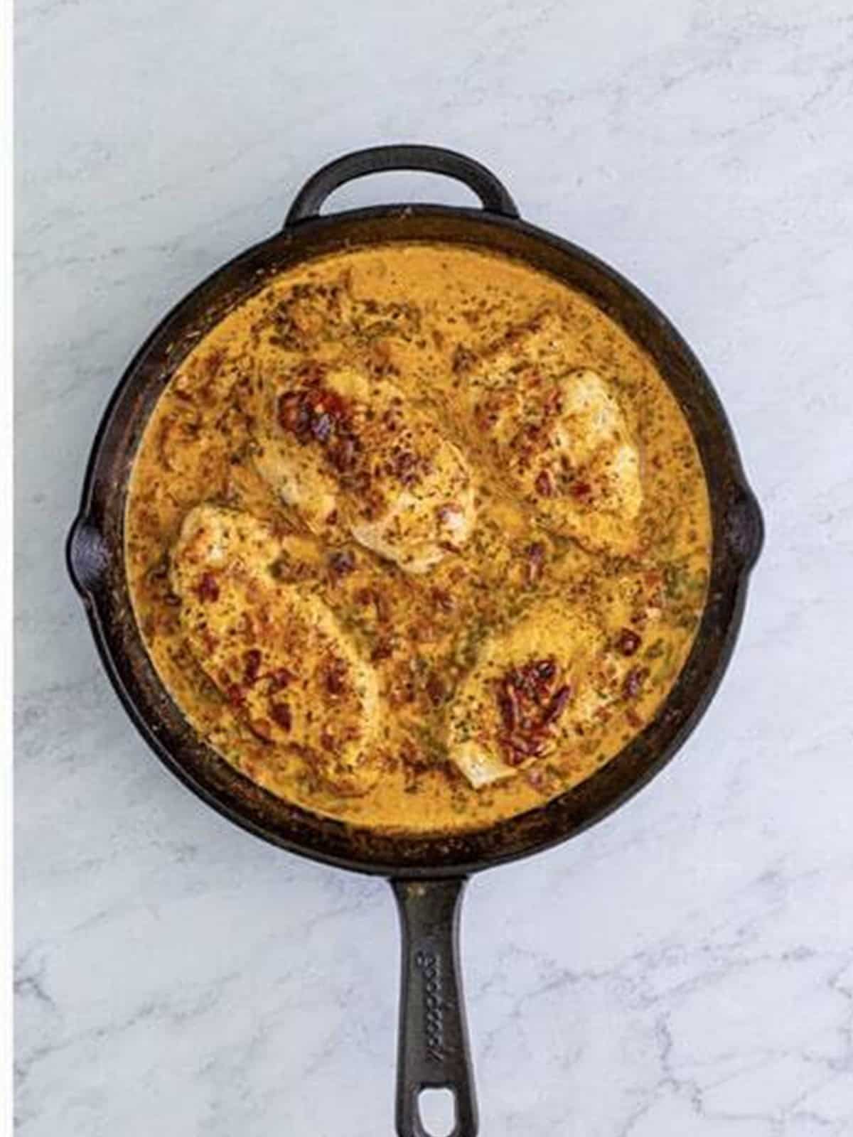 Baked Marry Me Chicken in creamy sundried tomato sauce ready to serve.