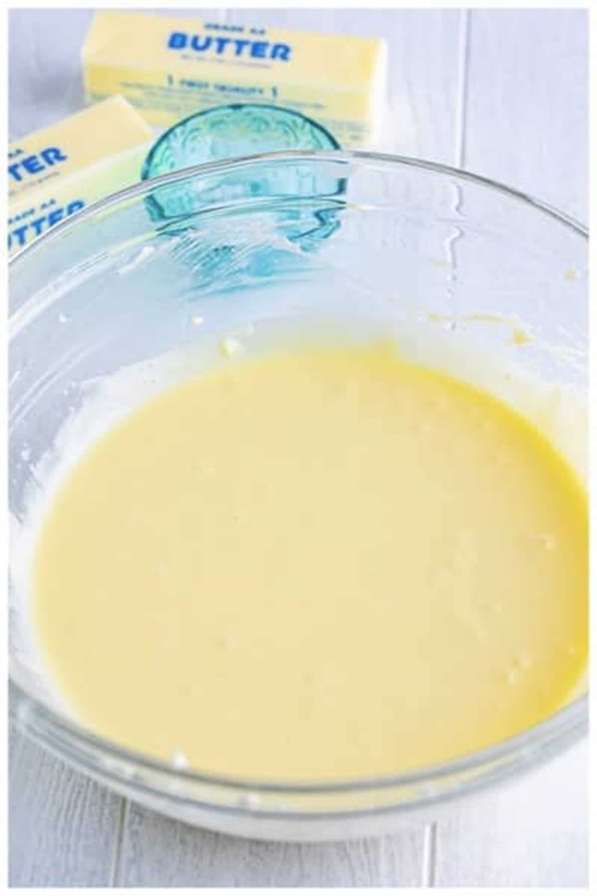 Smooth pineapple cheesecake batter poured into the prepared 9-inch springform pan ready for baking.