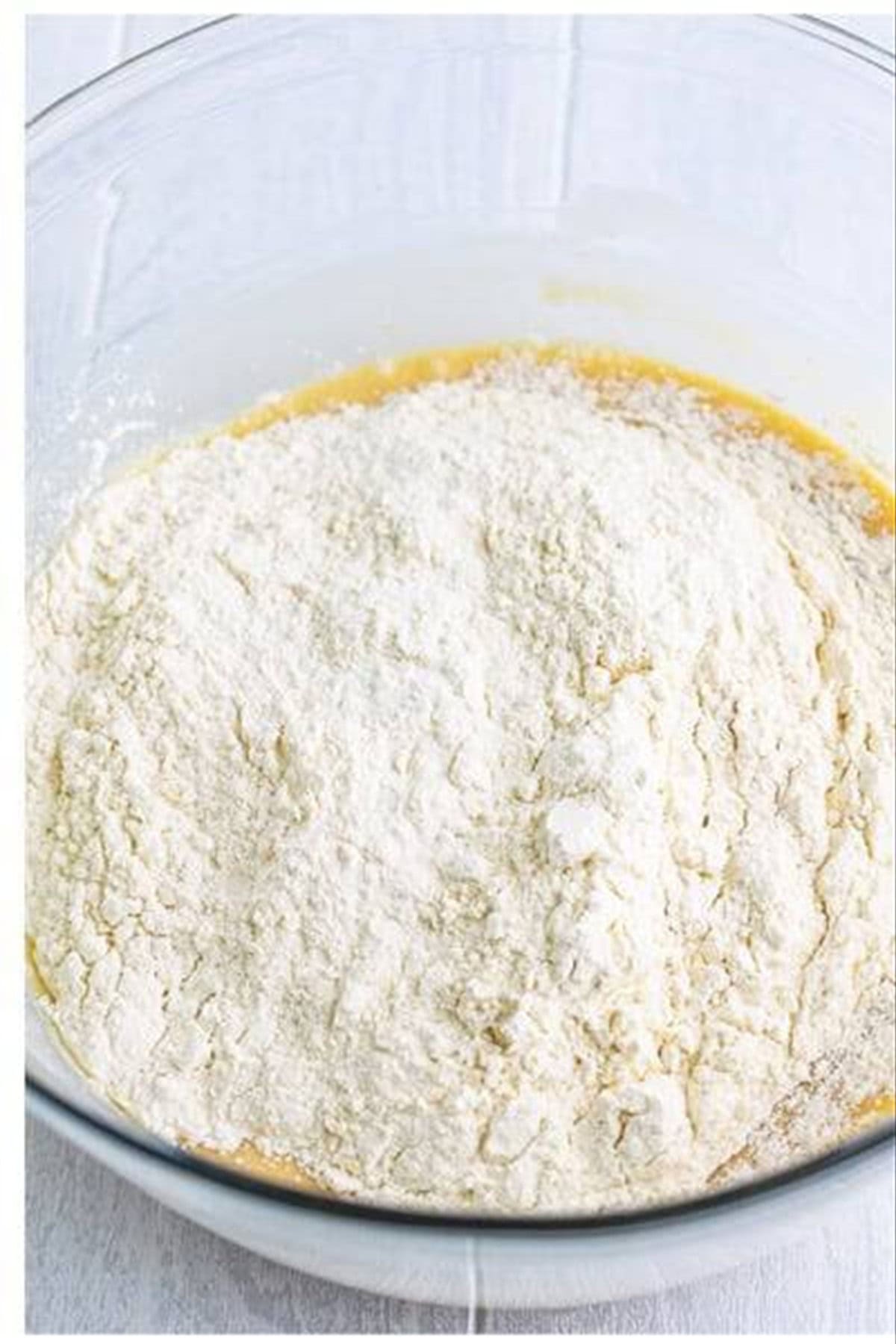 Wet pineapple cake mixture combined with the sifted dry flour mixture until smooth with no lumps for Copycat Pineapple Upside Down Cake.