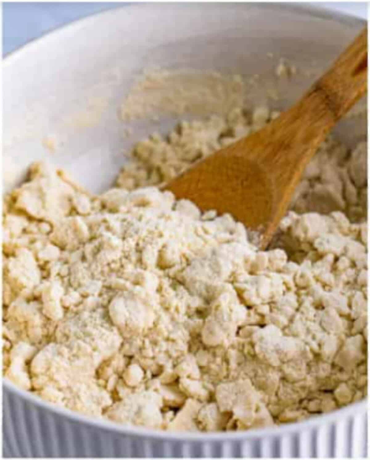 Masa harina, water, and salt combined in a large mixing bowl for a Pupusas Recipe.