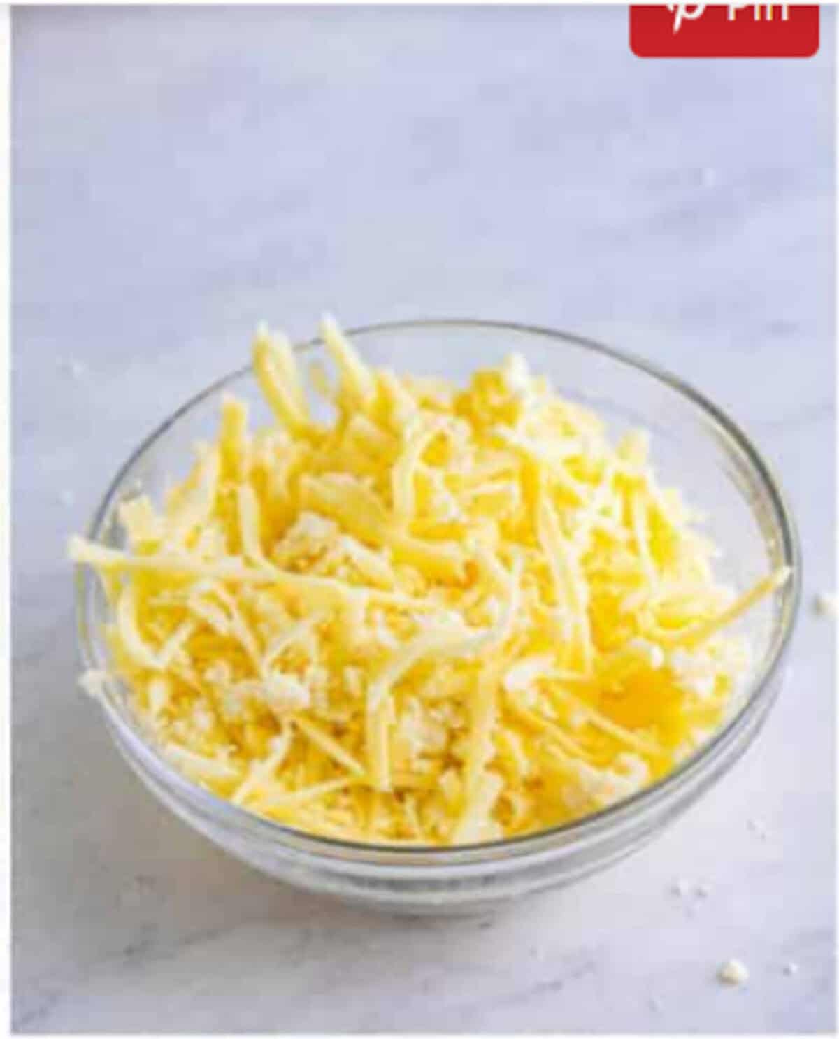 Shredded mozzarella and crumbled queso fresco tossed together as the cheese filling for a Pupusas Recipe.