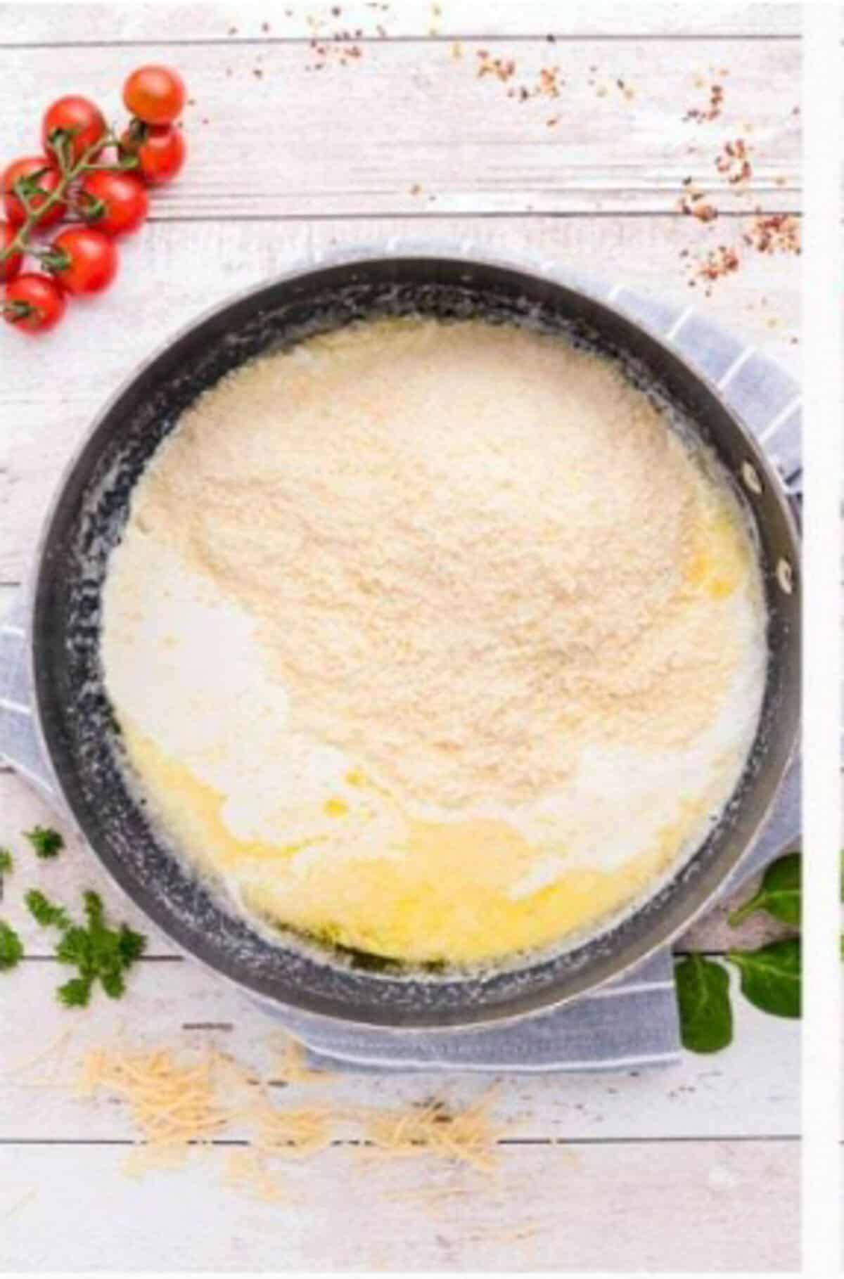 Heavy cream and freshly grated parmesan cheese whisked together and simmering in a large pot for the Creamy Kielbasa Pasta sauce.