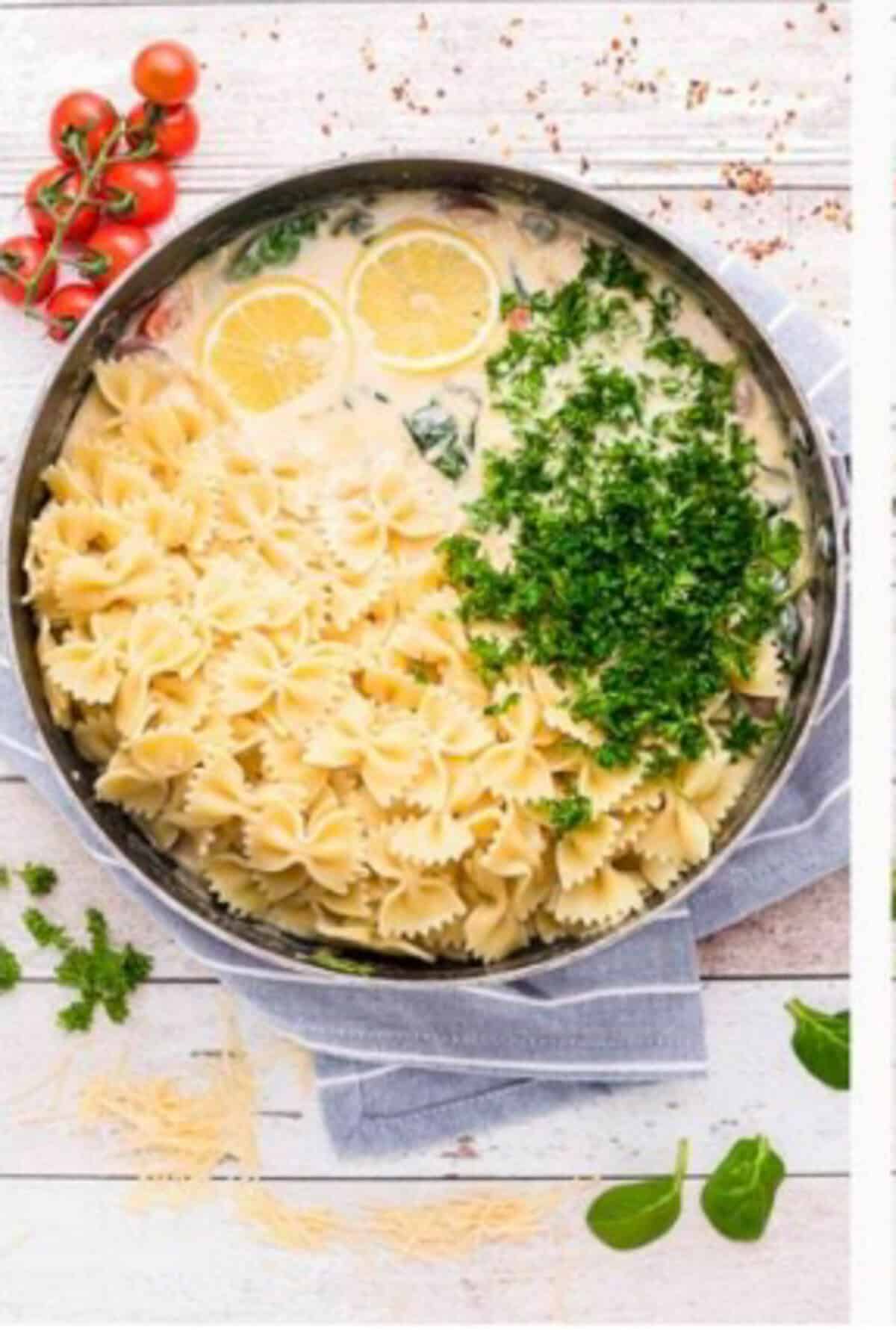 Finished Creamy Kielbasa Pasta garnished with chopped fresh parsley ready to serve from the pot.