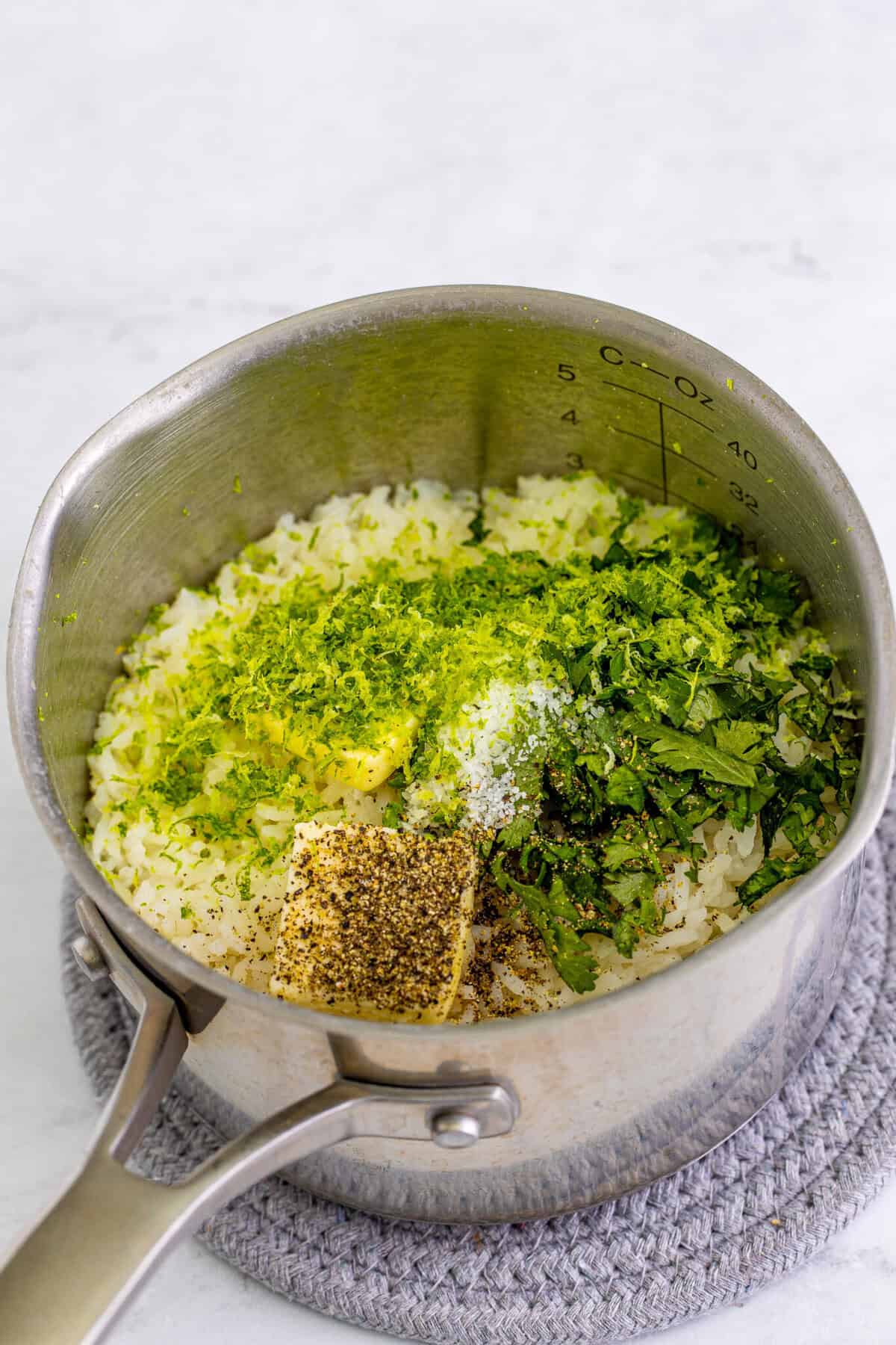 Water coming to a boil in a pot to start the cilantro lime rice for a Chipotle Bowl Recipe.