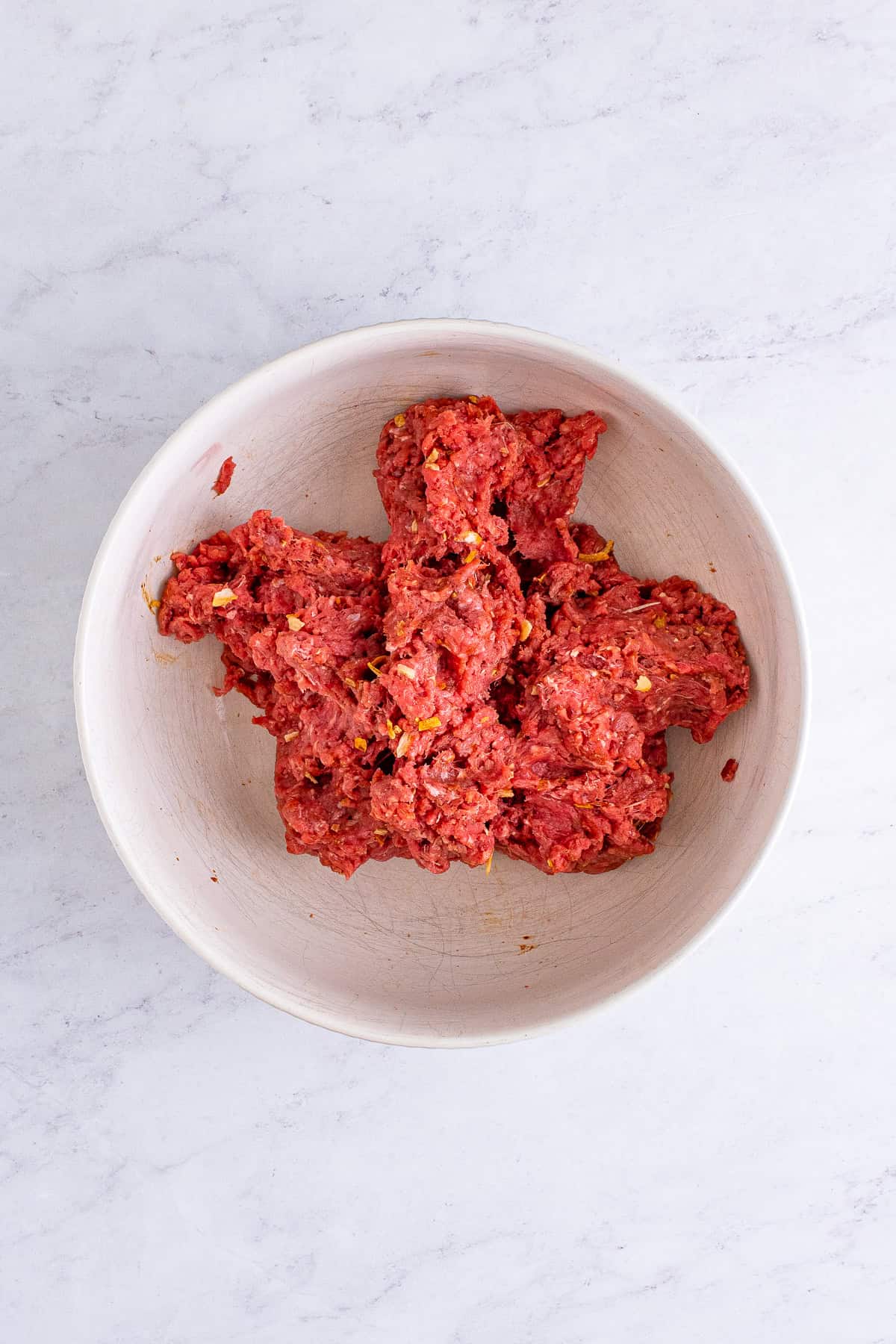 Seasoned ground beef mixture shaped for hamburger foil packet patties