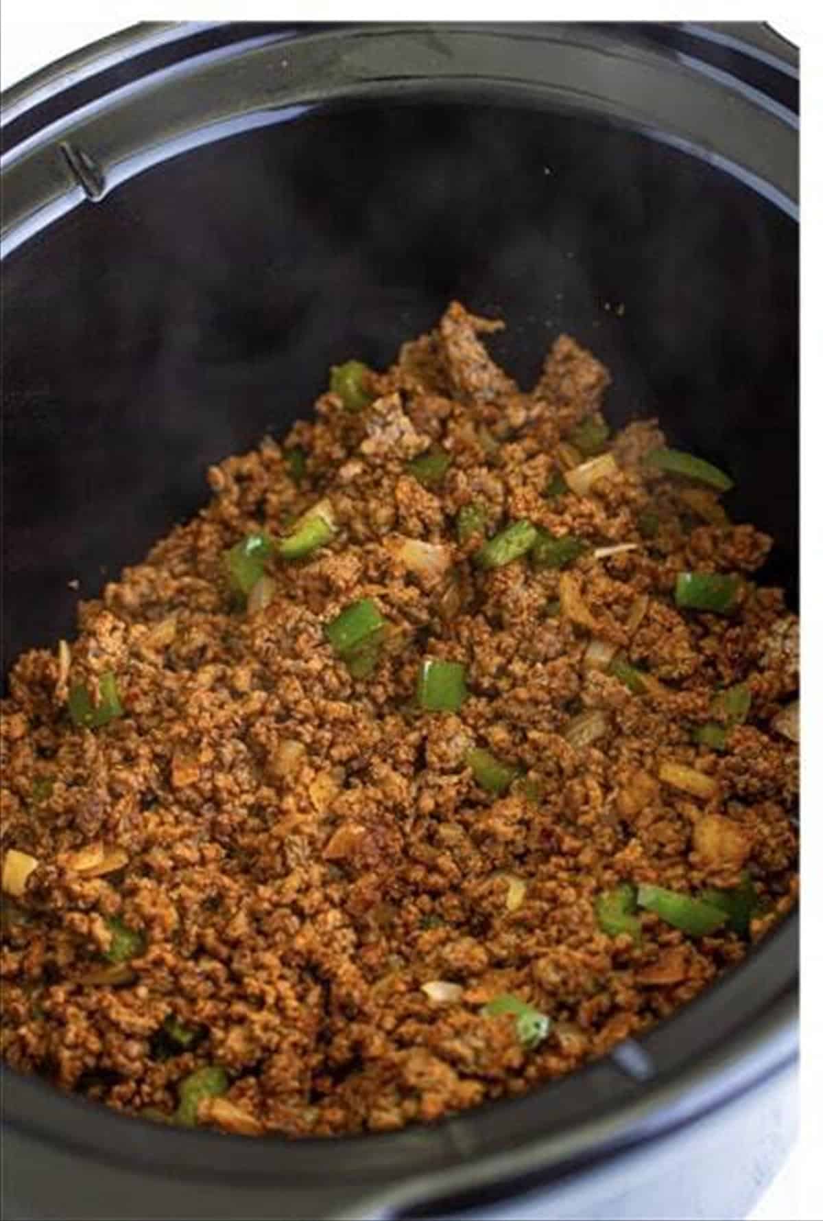 Seasoned beef mixture transferred to a slow cooker for award winning chili.