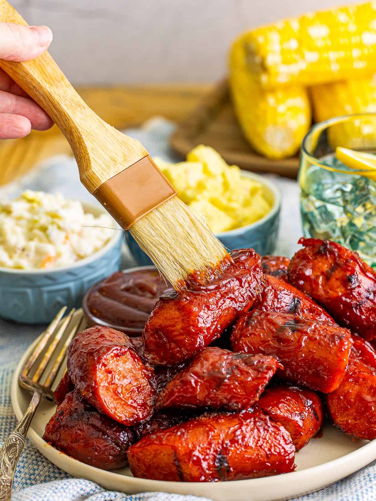 Charred BBQ smoked kielbasa on a plate.