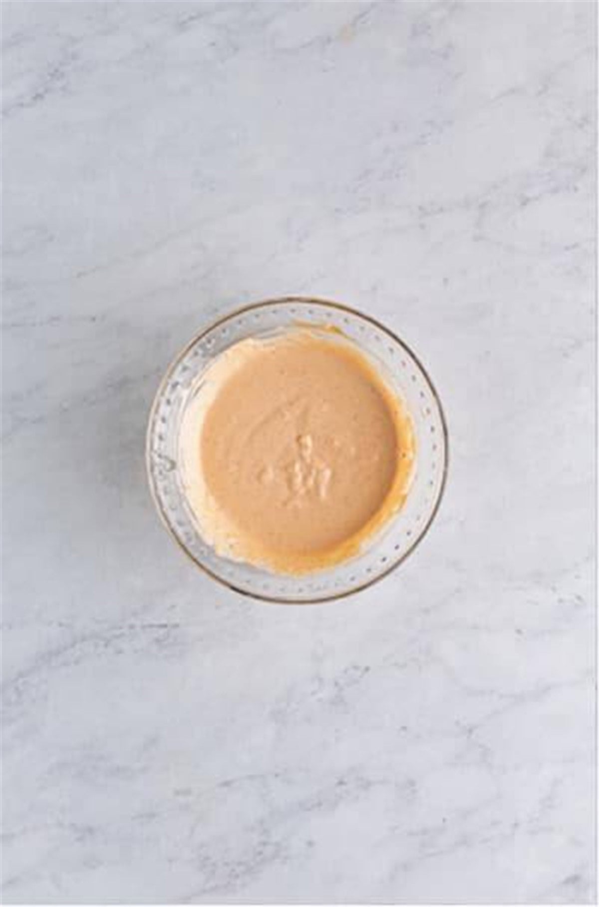 Whisk Outback bloom sauce ingredients together in a bowl for Crispy Onion Petals Recipe.