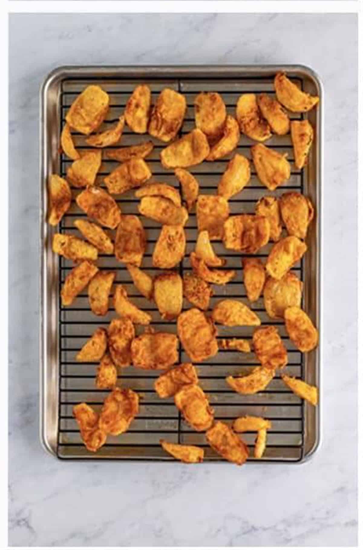 Serve crispy Onion Petals with Outback bloom dipping sauce on a white platter.