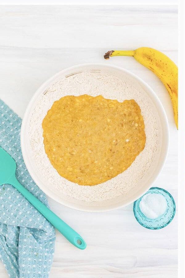 Folding wet banana mixture into the dry ingredients until just combined.