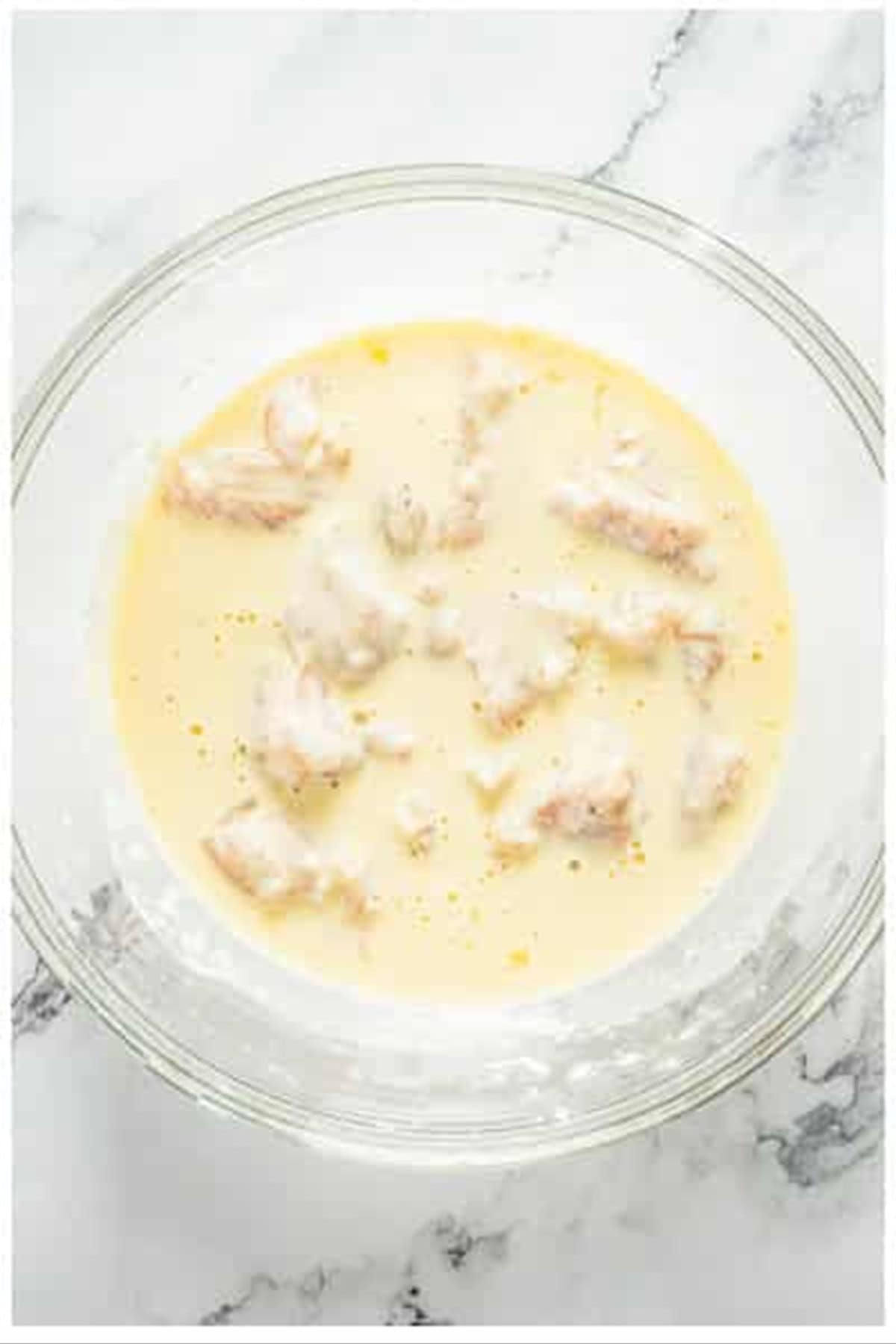 Diced chicken stirred into the batter for sweet and sour chicken.