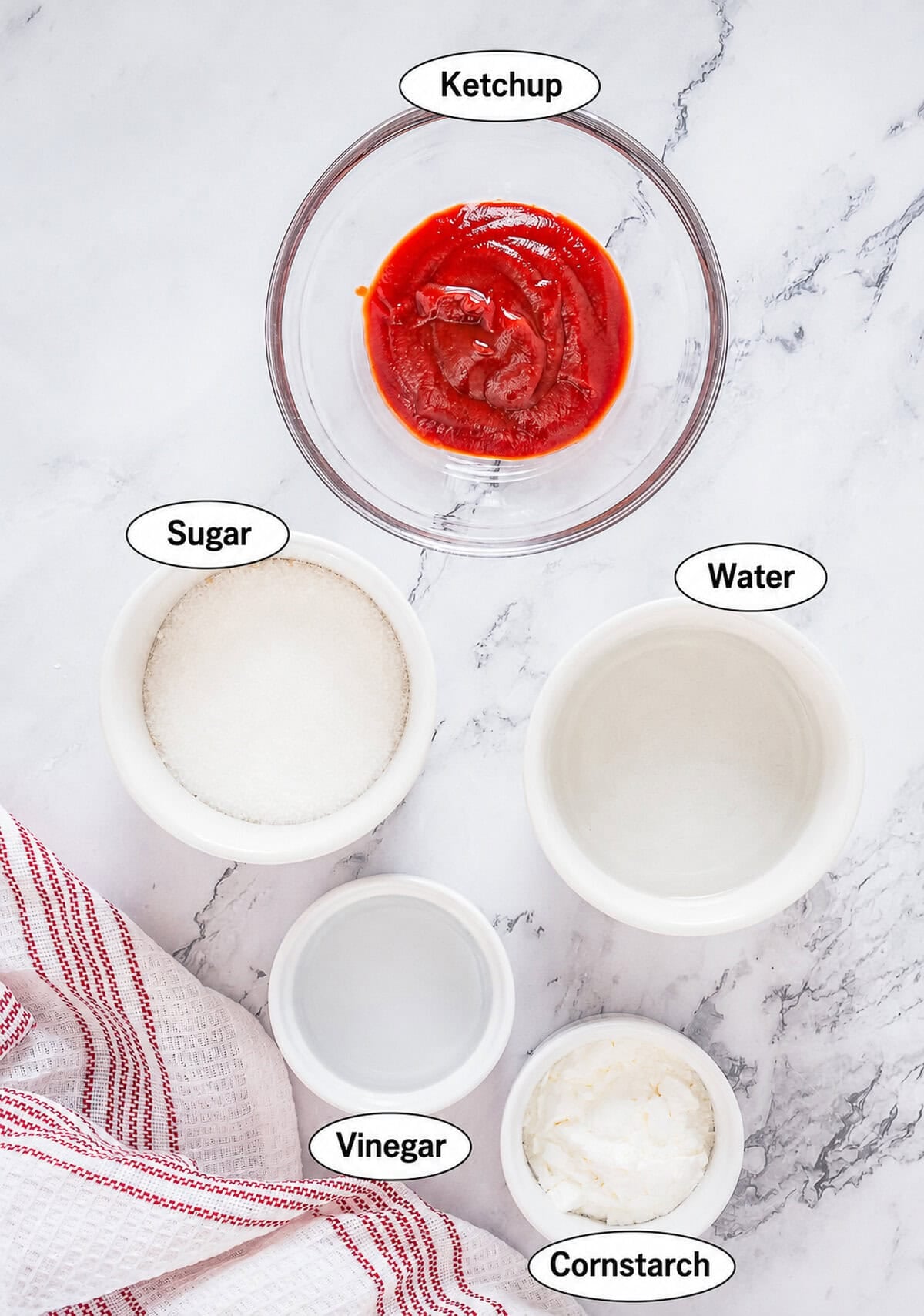 Sweet and Sour Sauce ingredients labeled in glass bowls including ketchup, sugar, water, vinegar, and cornstarch.