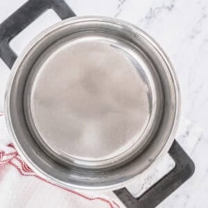Empty stainless saucepan ready for Sweet and Sour Sauce ingredients.