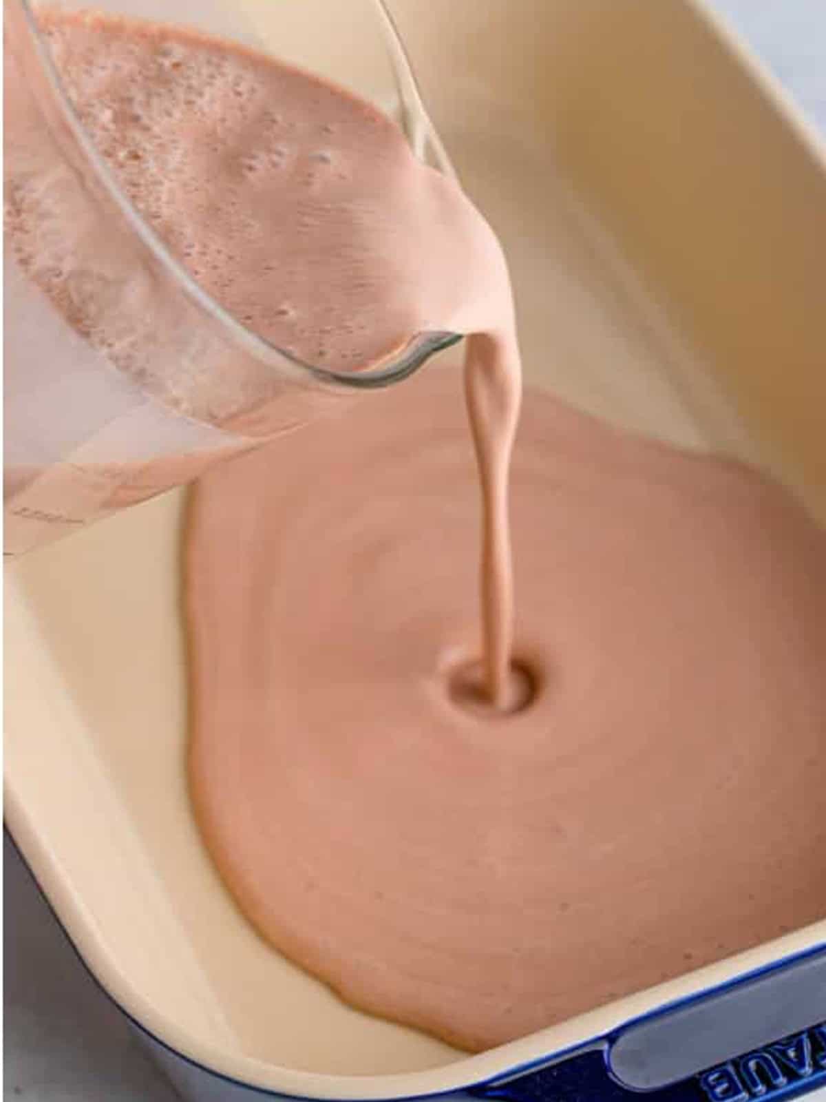 Pouring the Wendys Frosty mixture into a baking dish.