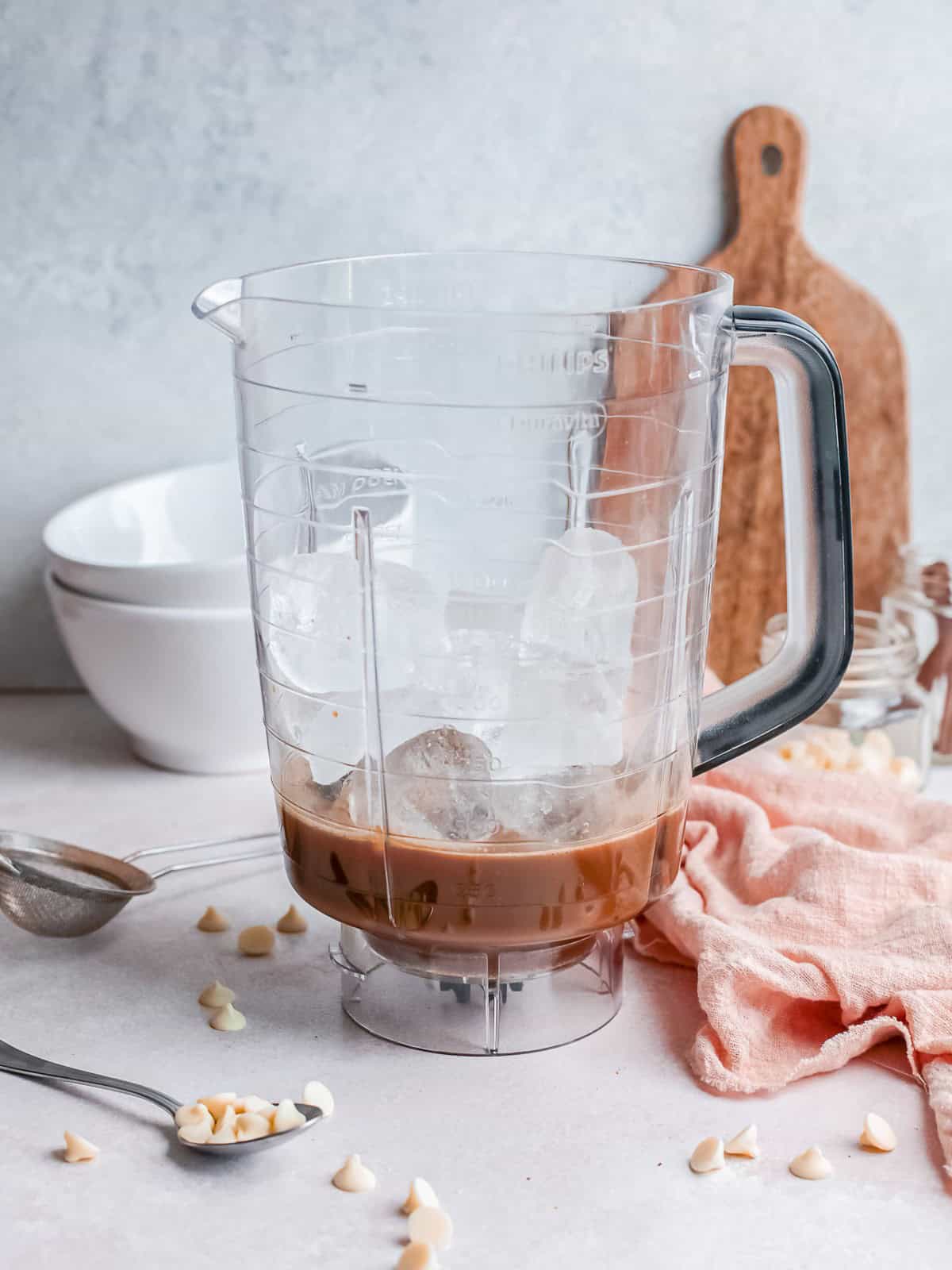 Blending the white chocolate mocha mixture with ice and half and half.