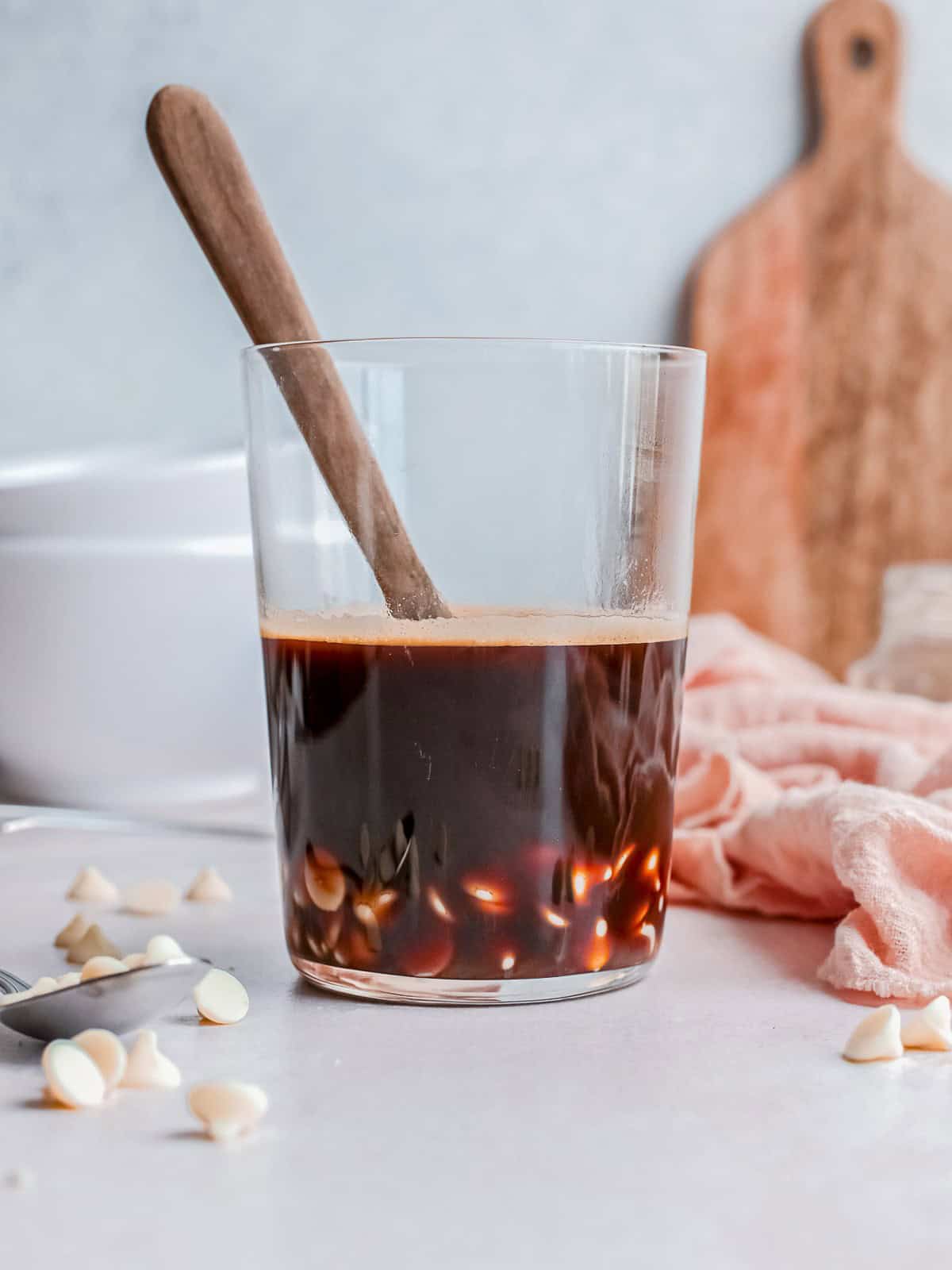 Stirring melted white chocolate and espresso together for a frappuccino.