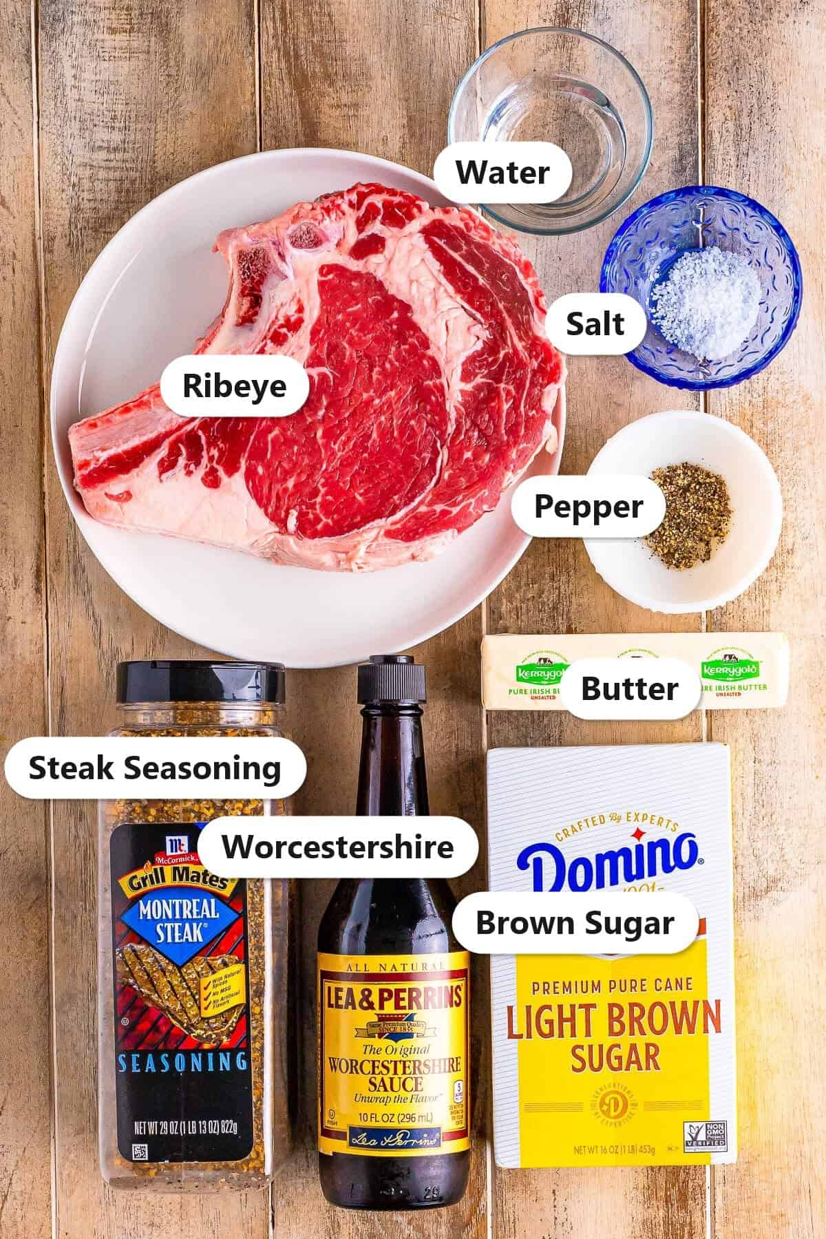 Labeled ingredients for air fryer ribeye steak: ribeye, water, salt, pepper, butter, steak seasoning, Worcestershire, and brown sugar.