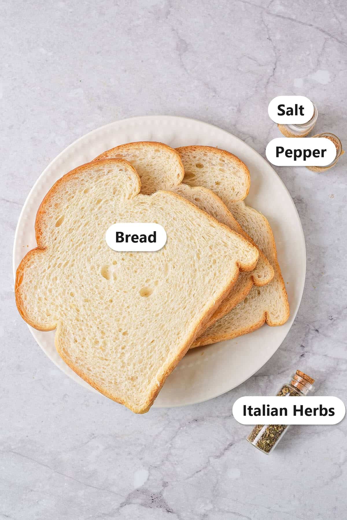 Labeled ingredients for homemade panko bread crumbs: bread, salt, pepper, and Italian herbs.