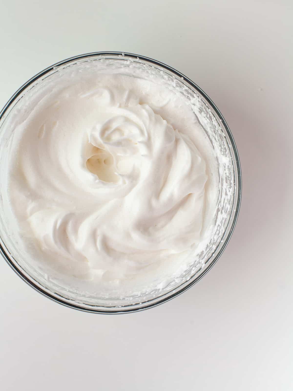 Egg whites whipped to soft peaks for 4th of July cupcakes.