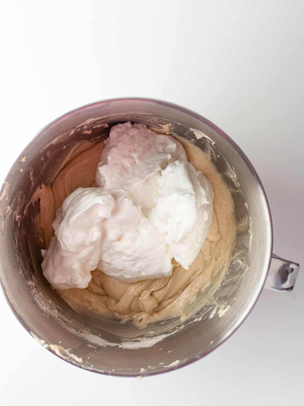Whipped egg whites folded into the cupcake batter.