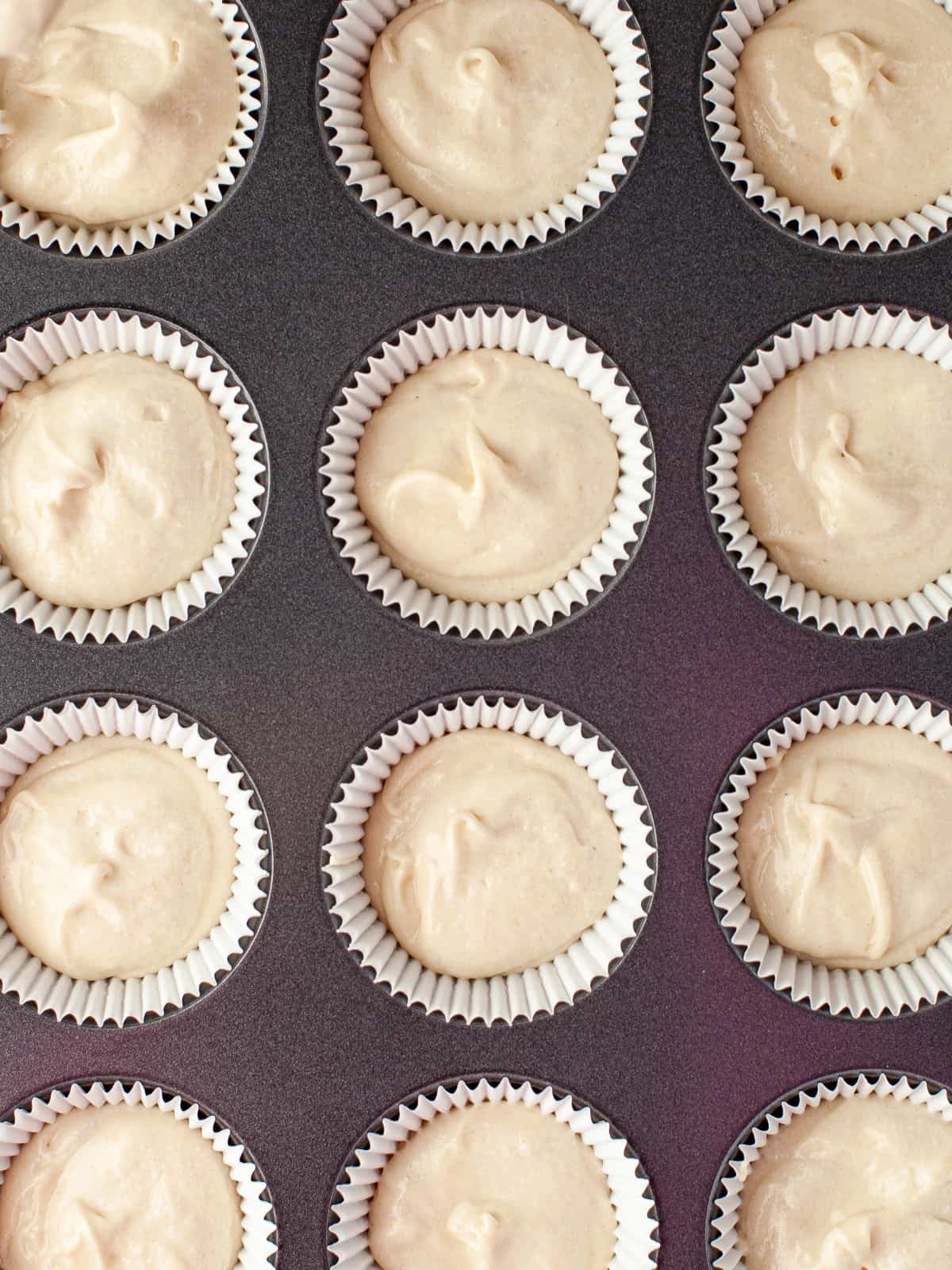 Cupcake liners filled with batter for 4th of July cupcakes.