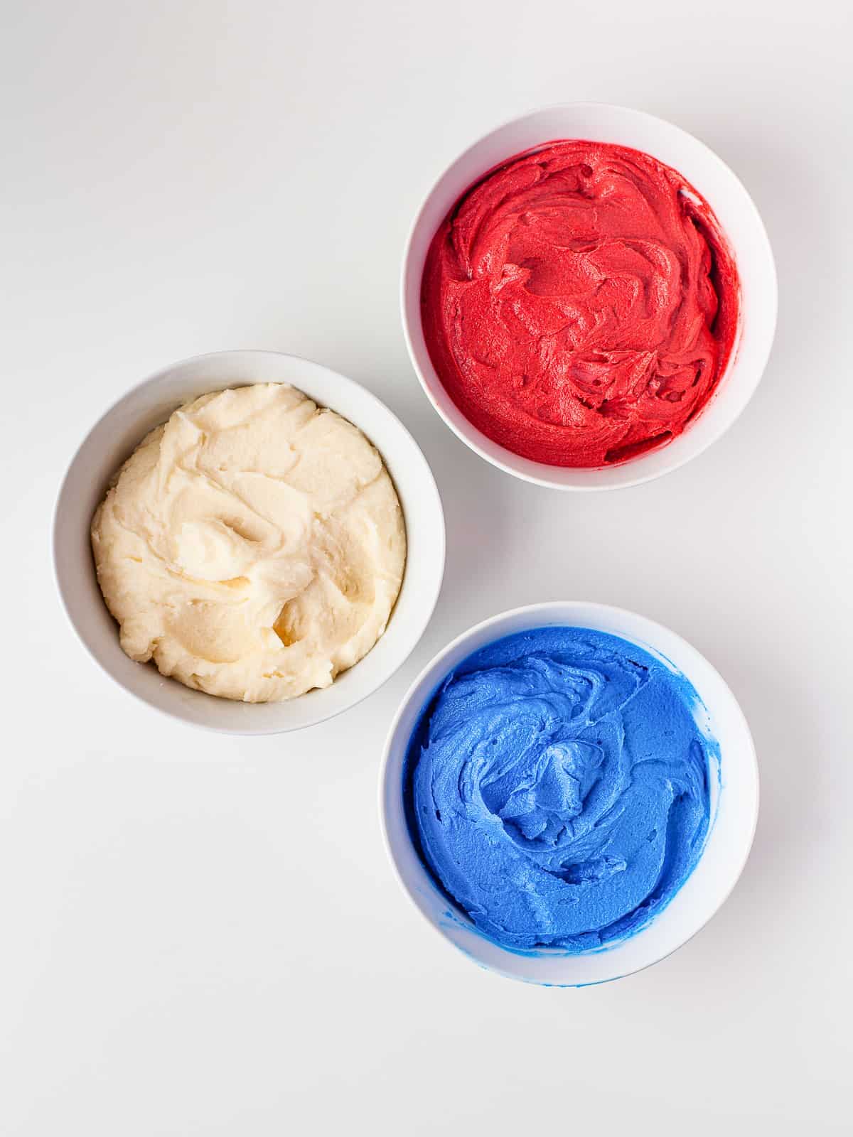 Buttercream tinted red, white, and blue for 4th of July cupcakes.