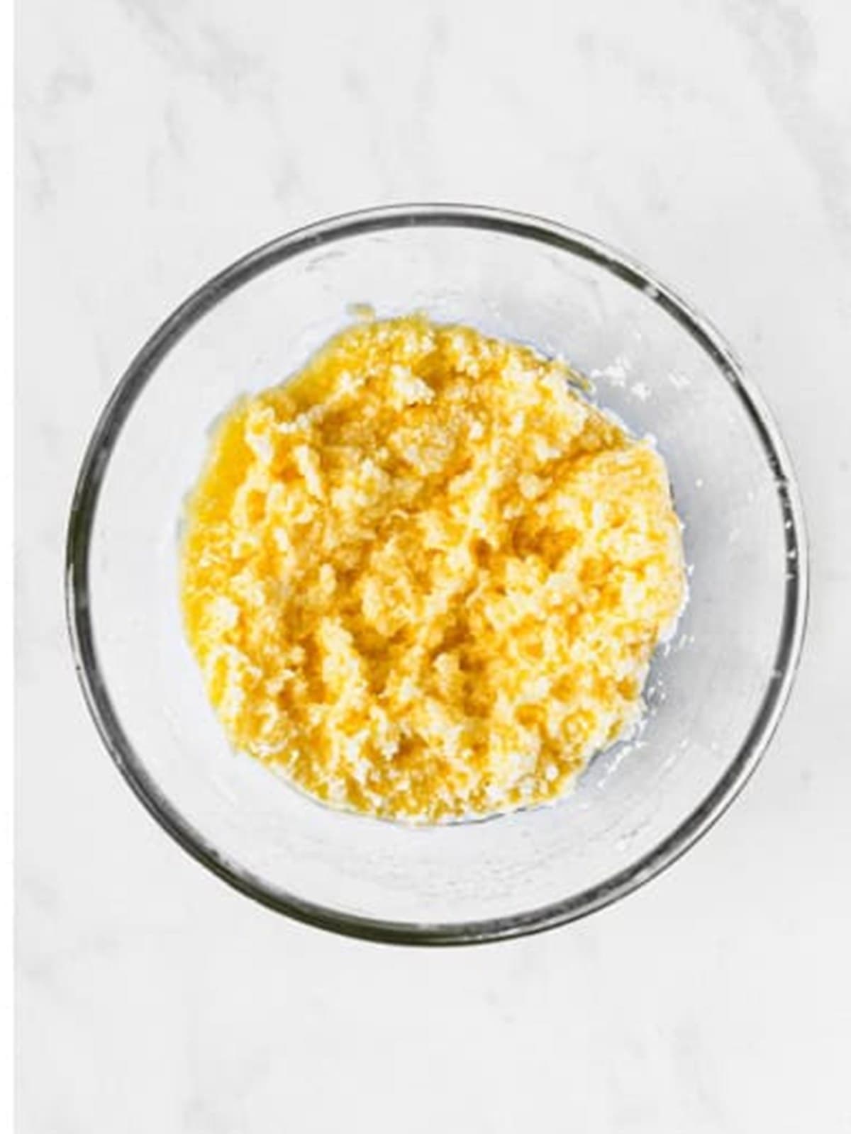 Butter, sugar, egg, and vanilla beaten together in a glass bowl for 4th of july fruit pizza crust.