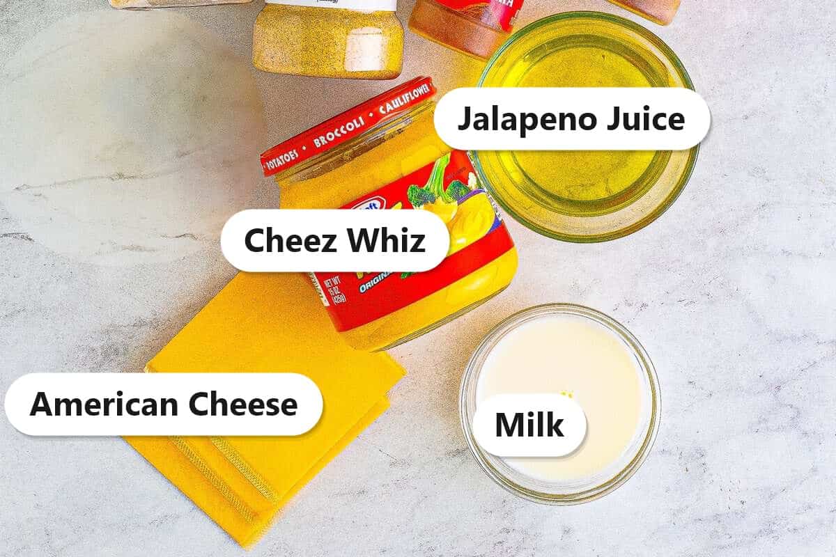 Labeled ingredients for copycat Taco Bell nacho cheese: Cheez Whiz, jalapeno juice, American cheese, and milk.