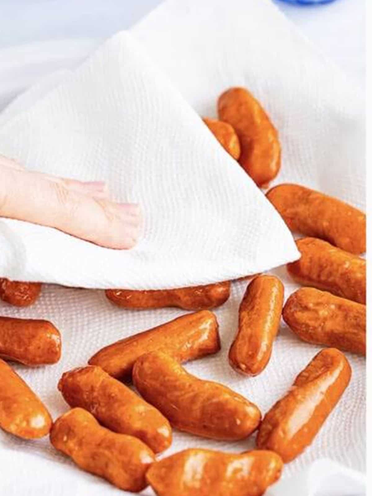 Patting lil smokies dry with a paper towel before wrapping.