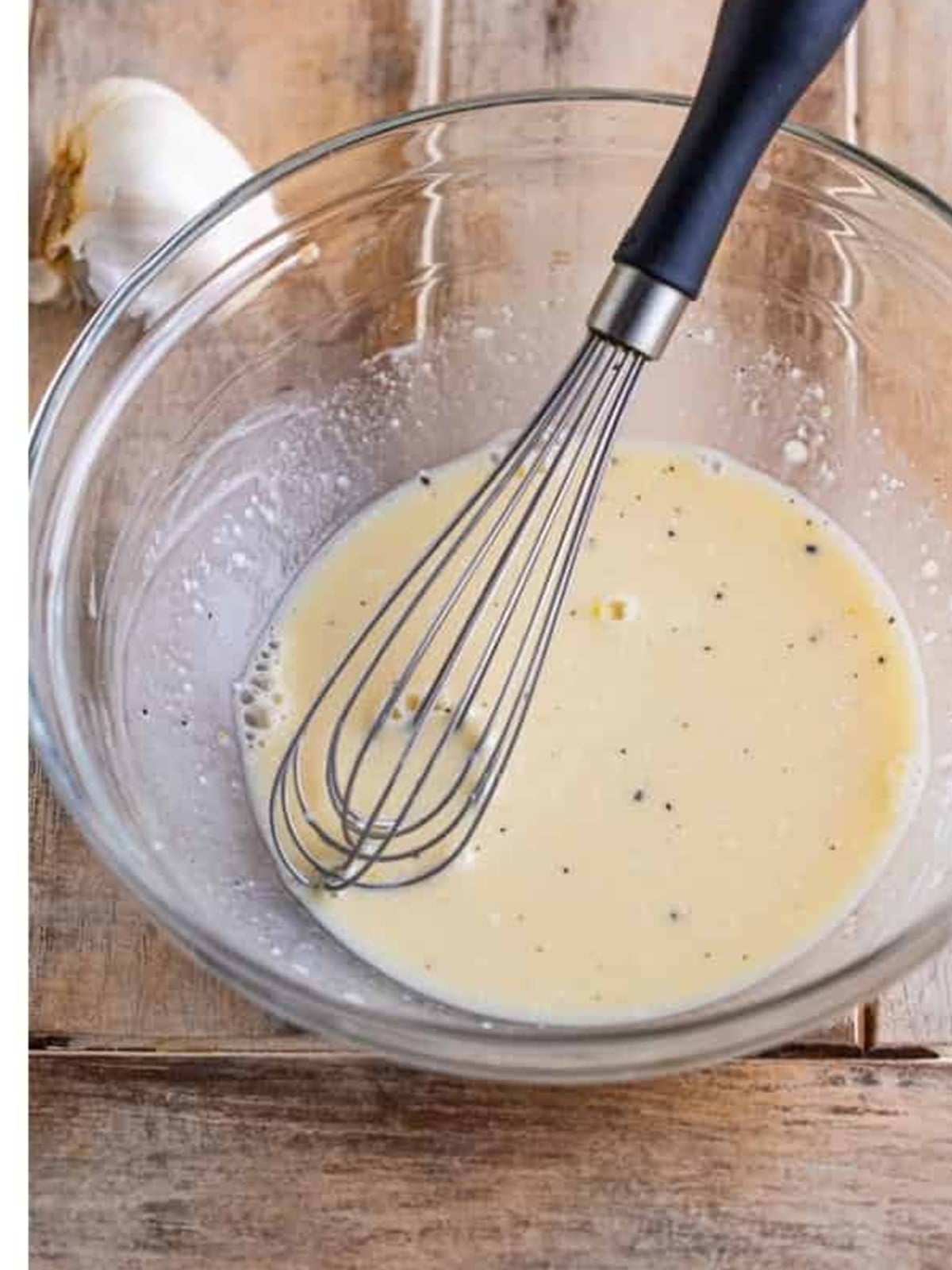 Whisked apple cider vinegar dressing base until smooth.