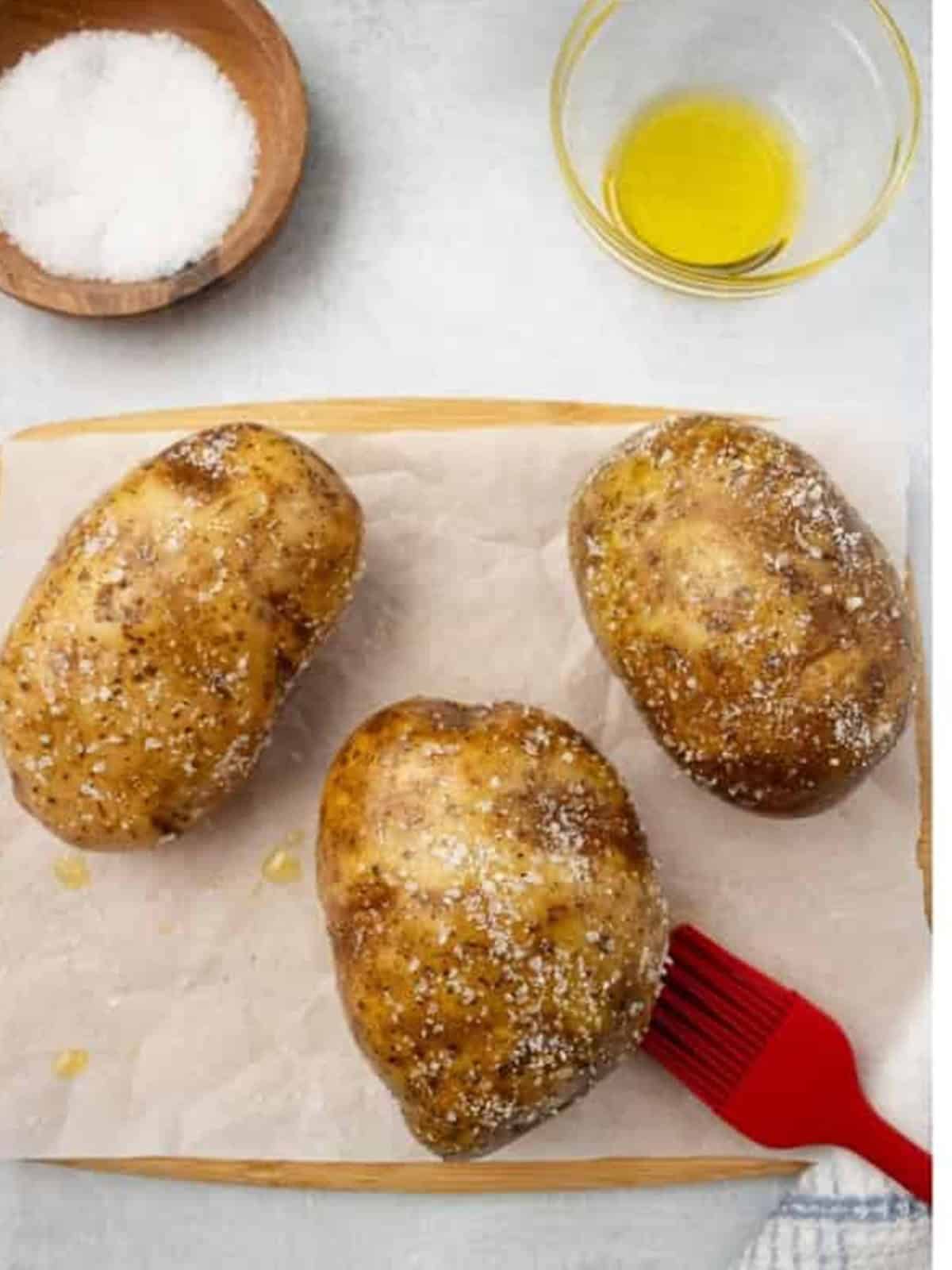 Russet potatoes sprinkled generously with kosher salt.