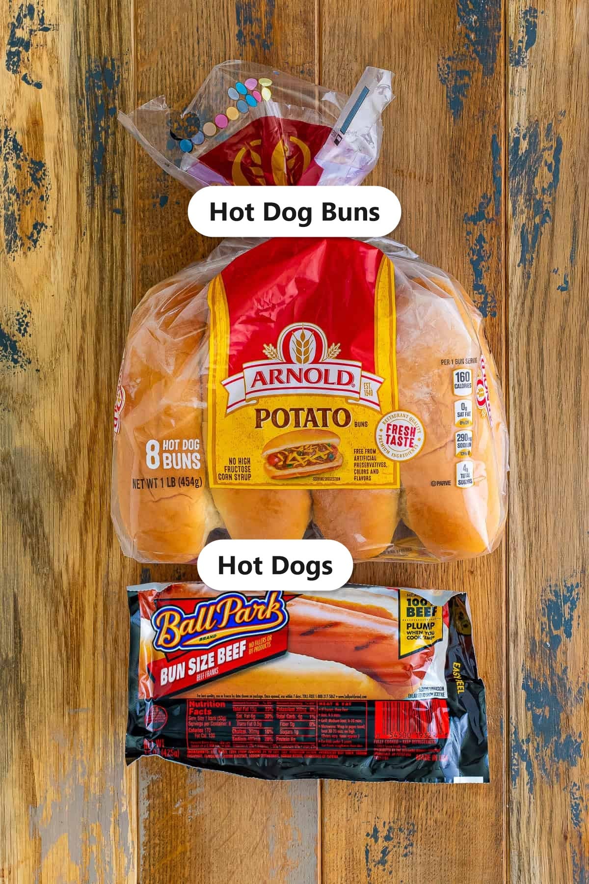 Labeled ingredients for air fryer hot dogs including hot dogs and hot dog buns.