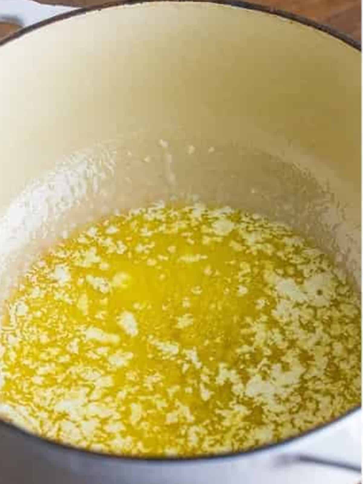 Butter melting in a Dutch oven to start the alfredo pasta sauce.