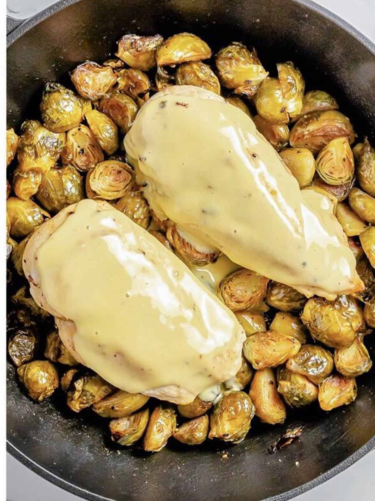 Honey mustard smeared over the baked chicken breasts.