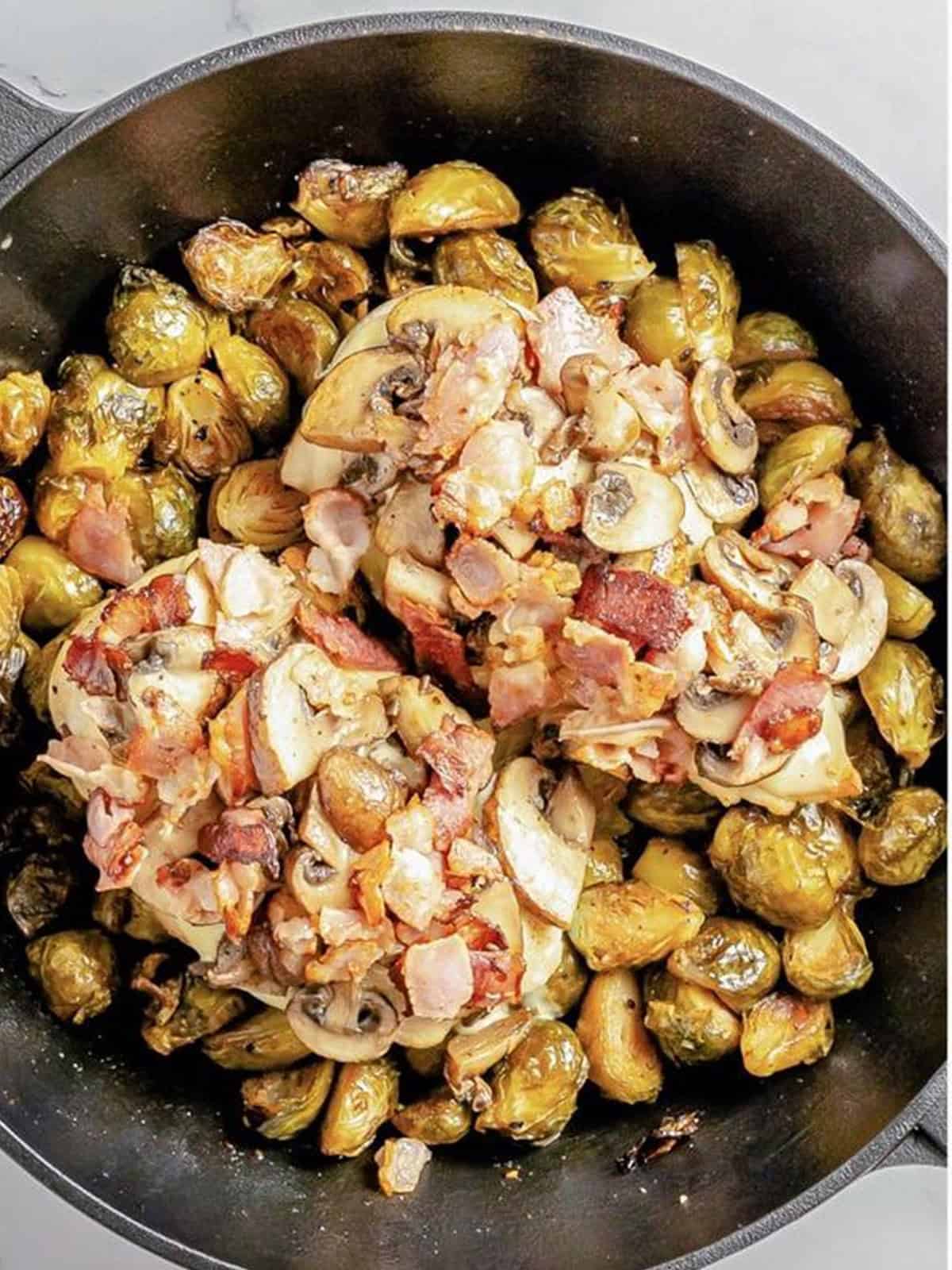 Sauteed mushrooms and crispy bacon added on top of the chicken.