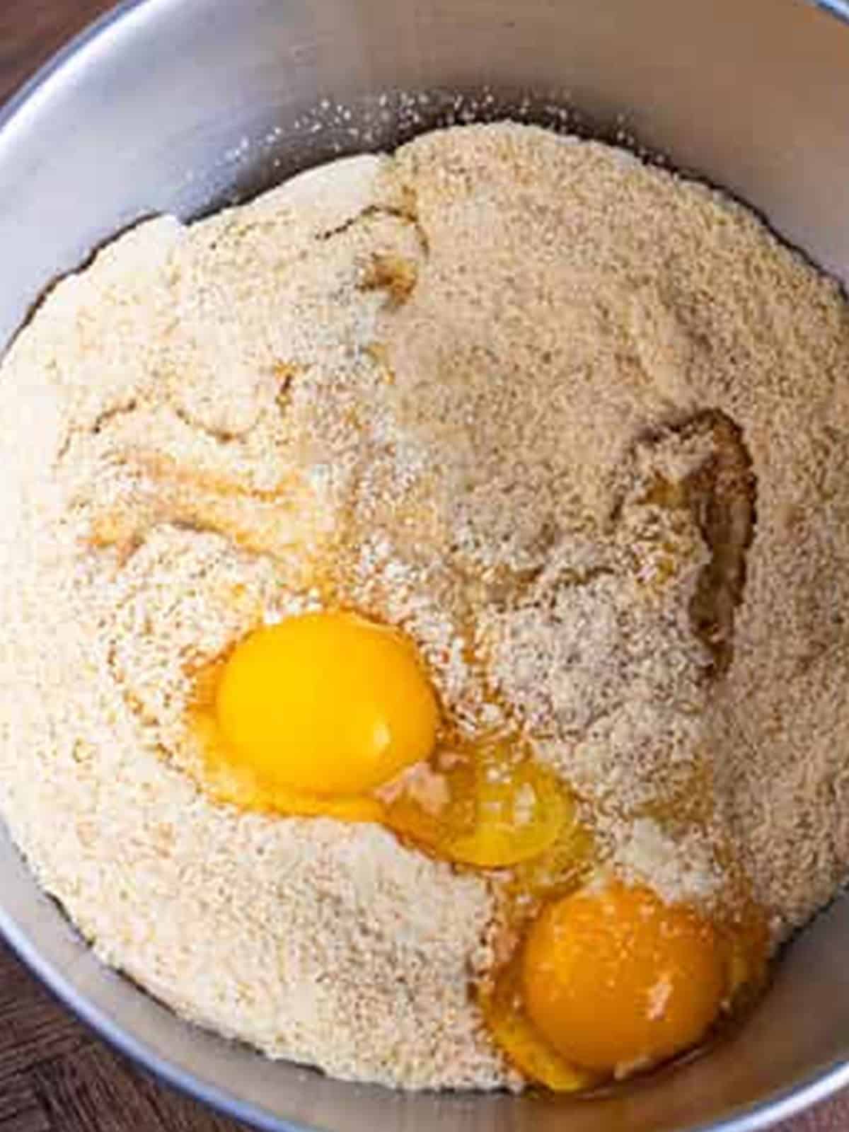 Eggs and extracts added to the almond flour mixture.