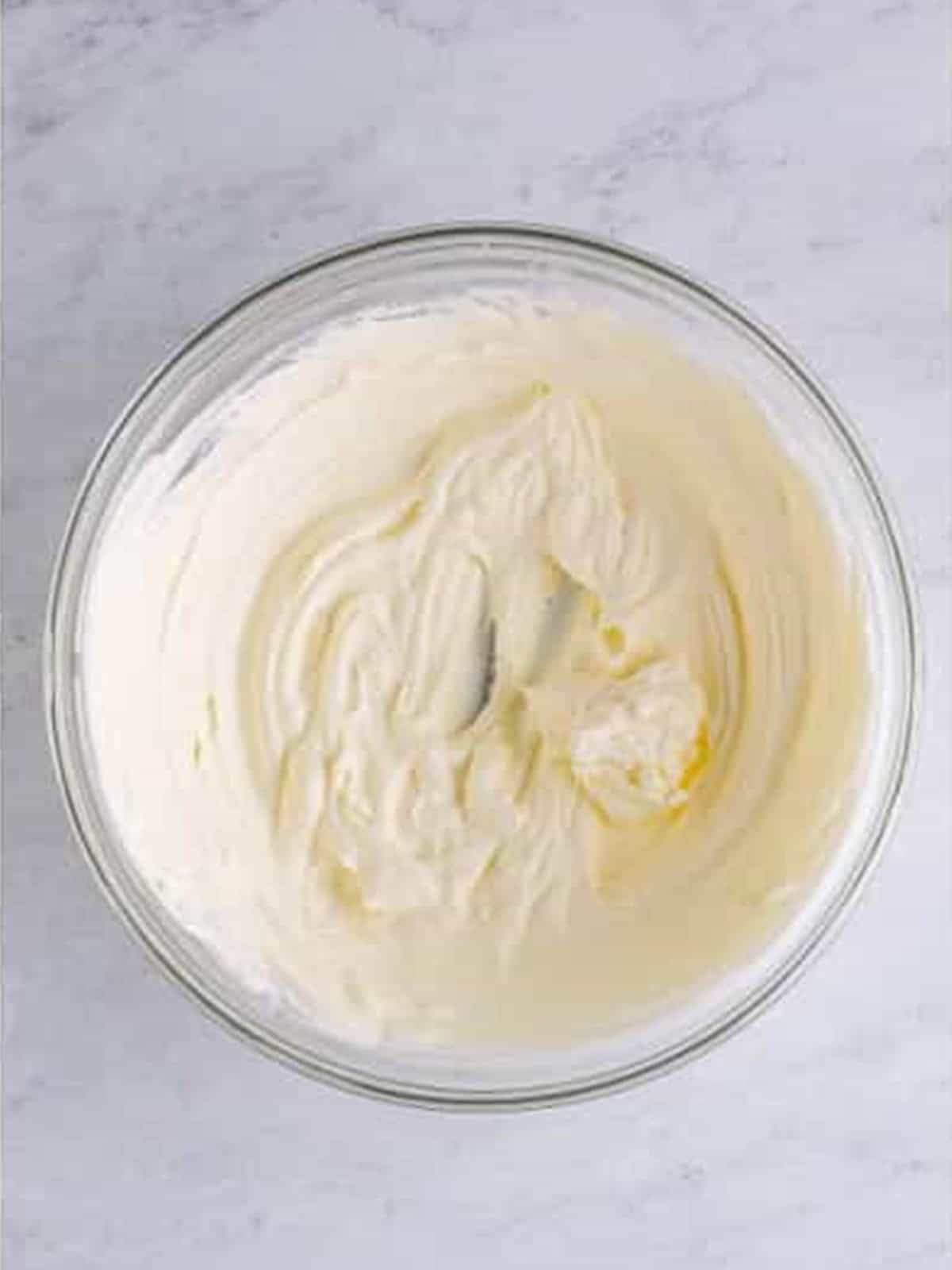 Heavy cream and powdered sugar whipped to stiff peaks for ambrosia salad.