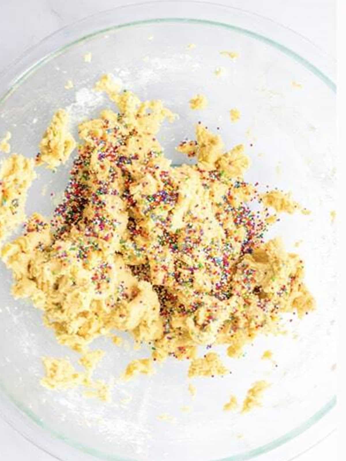 Rainbow sprinkles folded into animal cracker cookie dough.