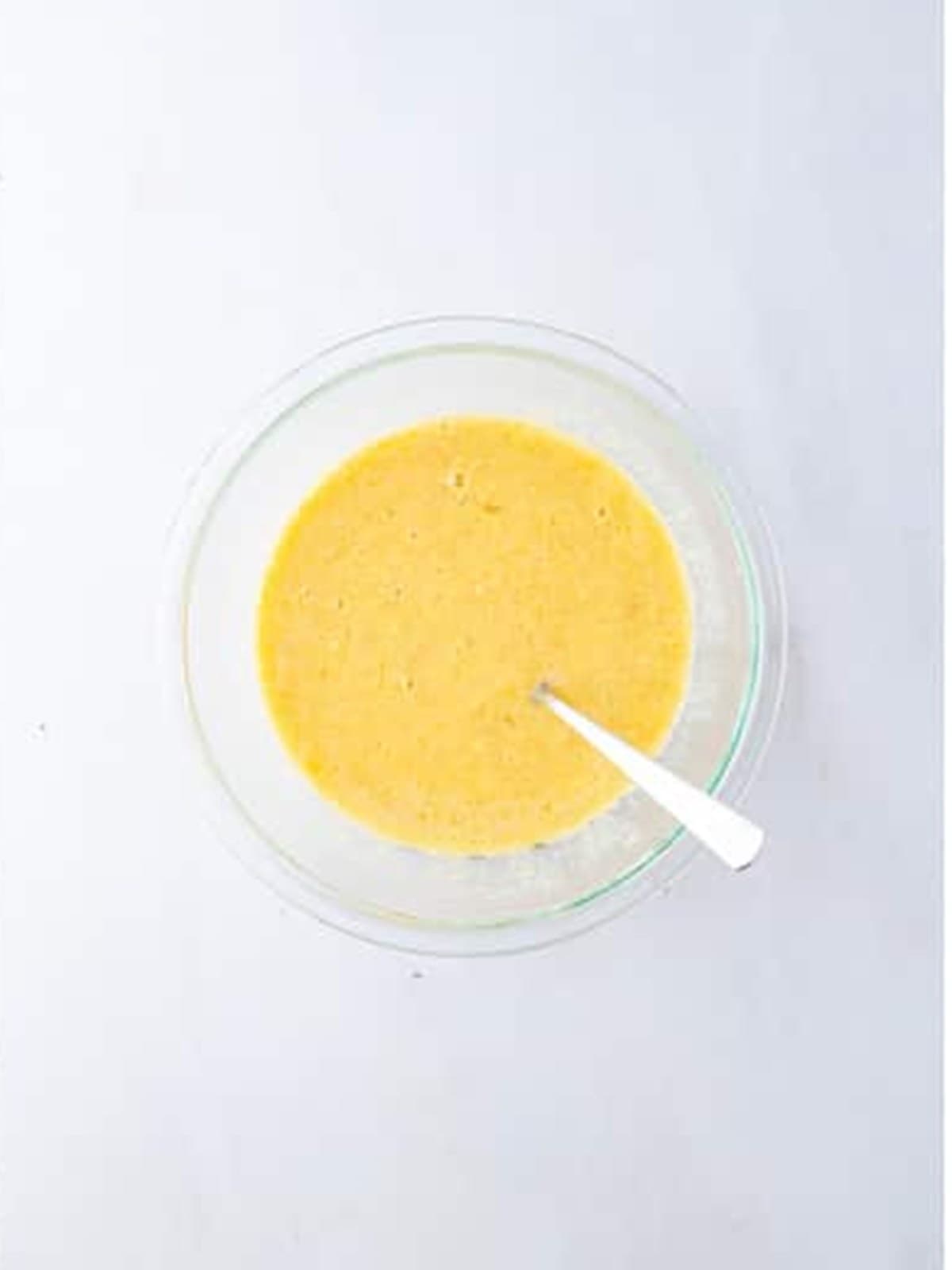 Wet ingredients mixed until smooth for apple banana muffin batter.