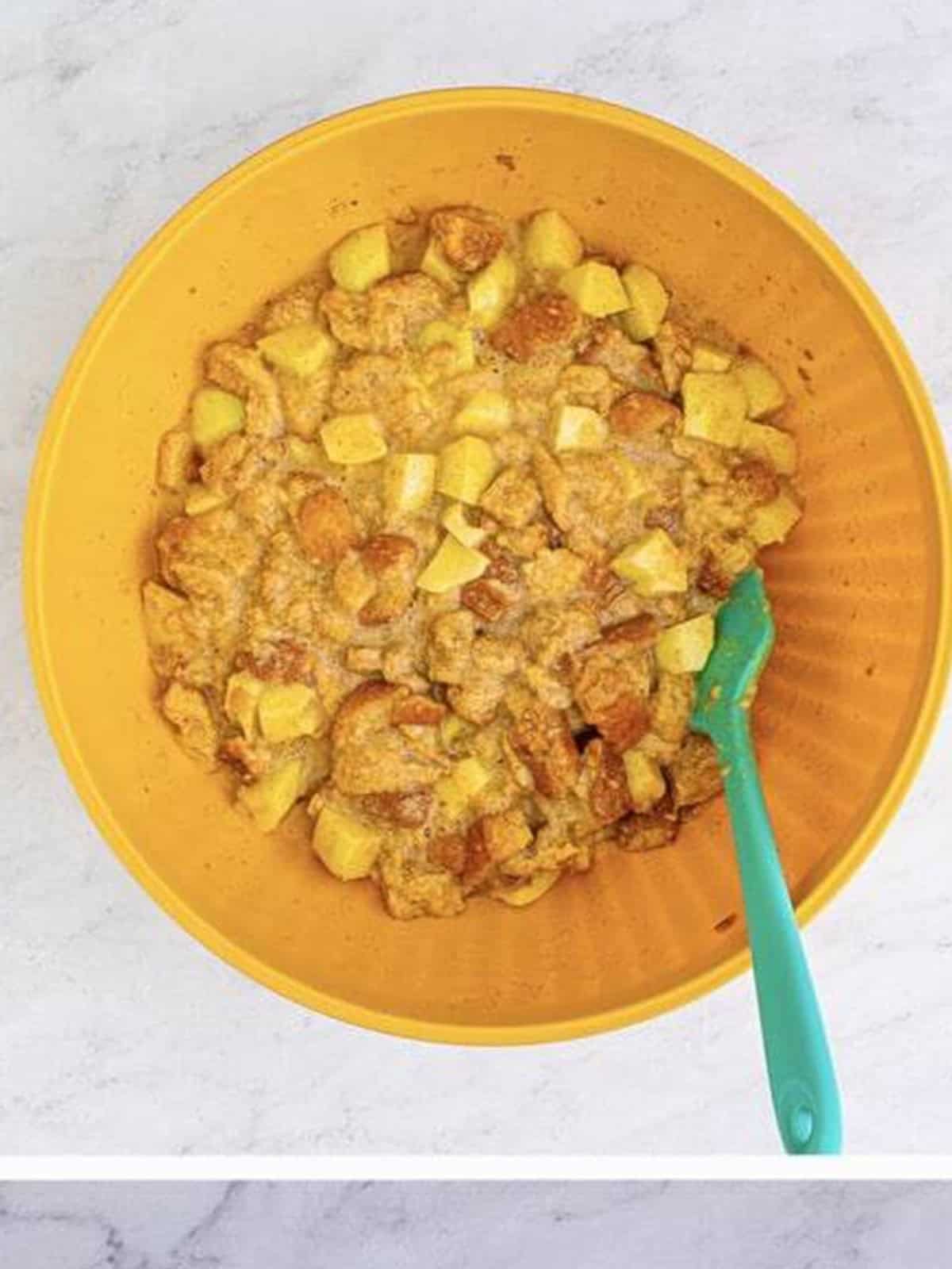 The apple bread pudding mixture folded together with beaten eggs.
